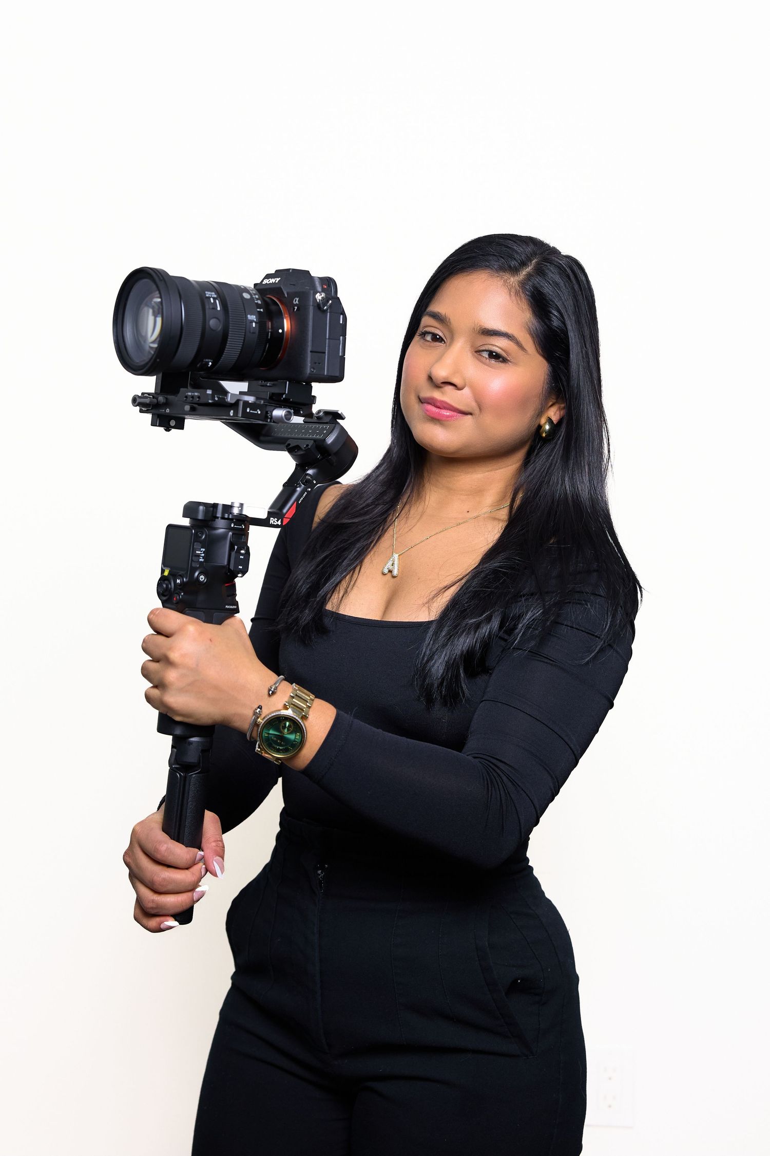 Professional photographer demonstrates camera handling techniques in studio setting.