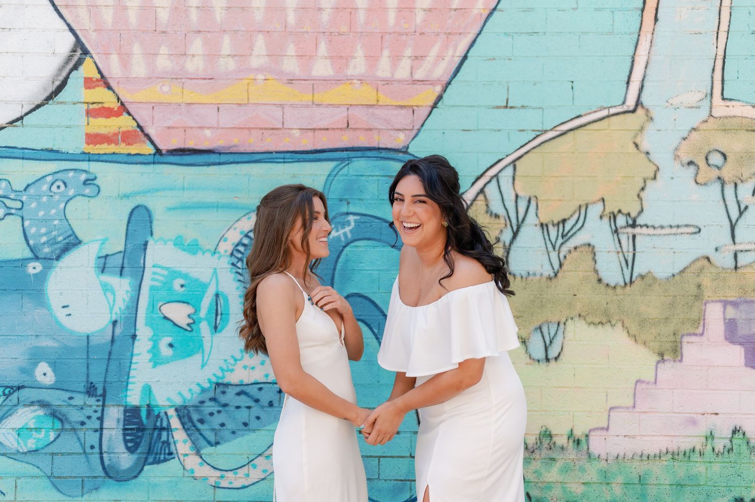 A collage of romantic couple silhouettes against pastel colored murals and painted walls.