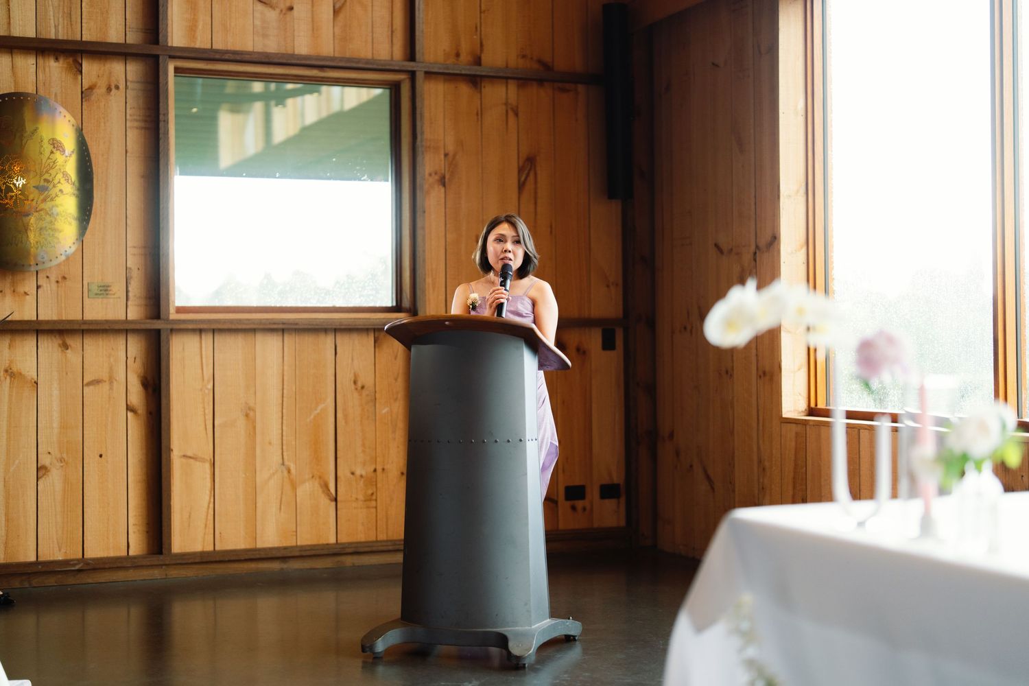 Interior of a wooden room with natural lighting coming through windows.