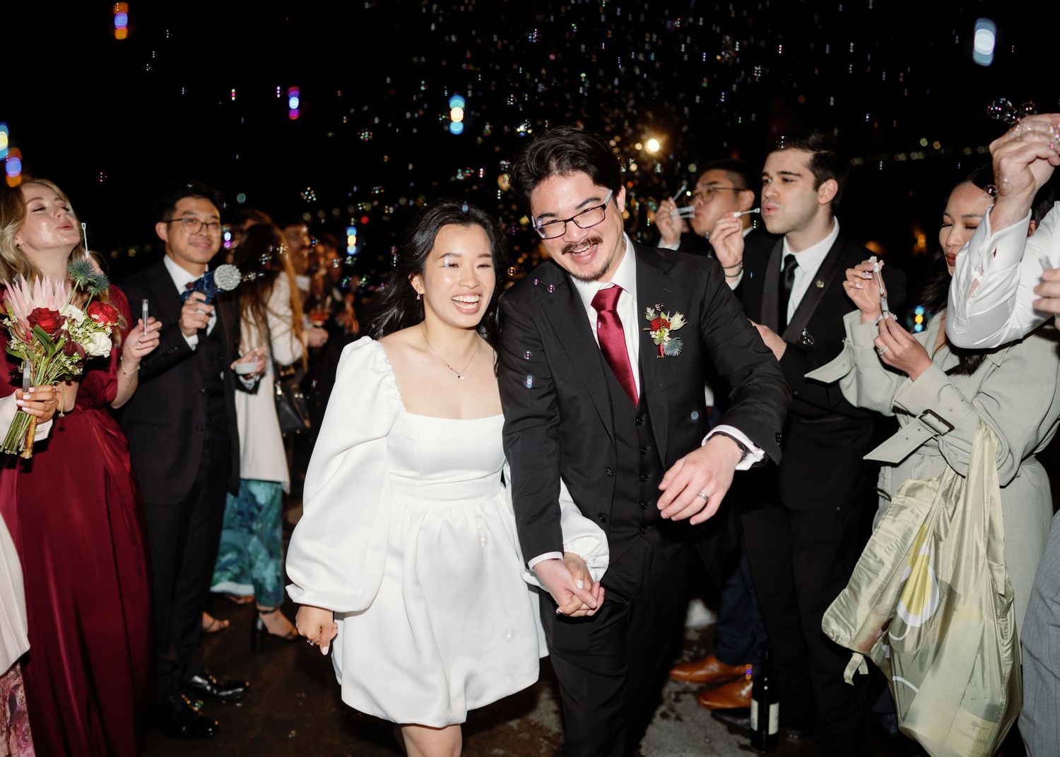 Wedding celebration at night with sparklers creating a festive atmosphere.