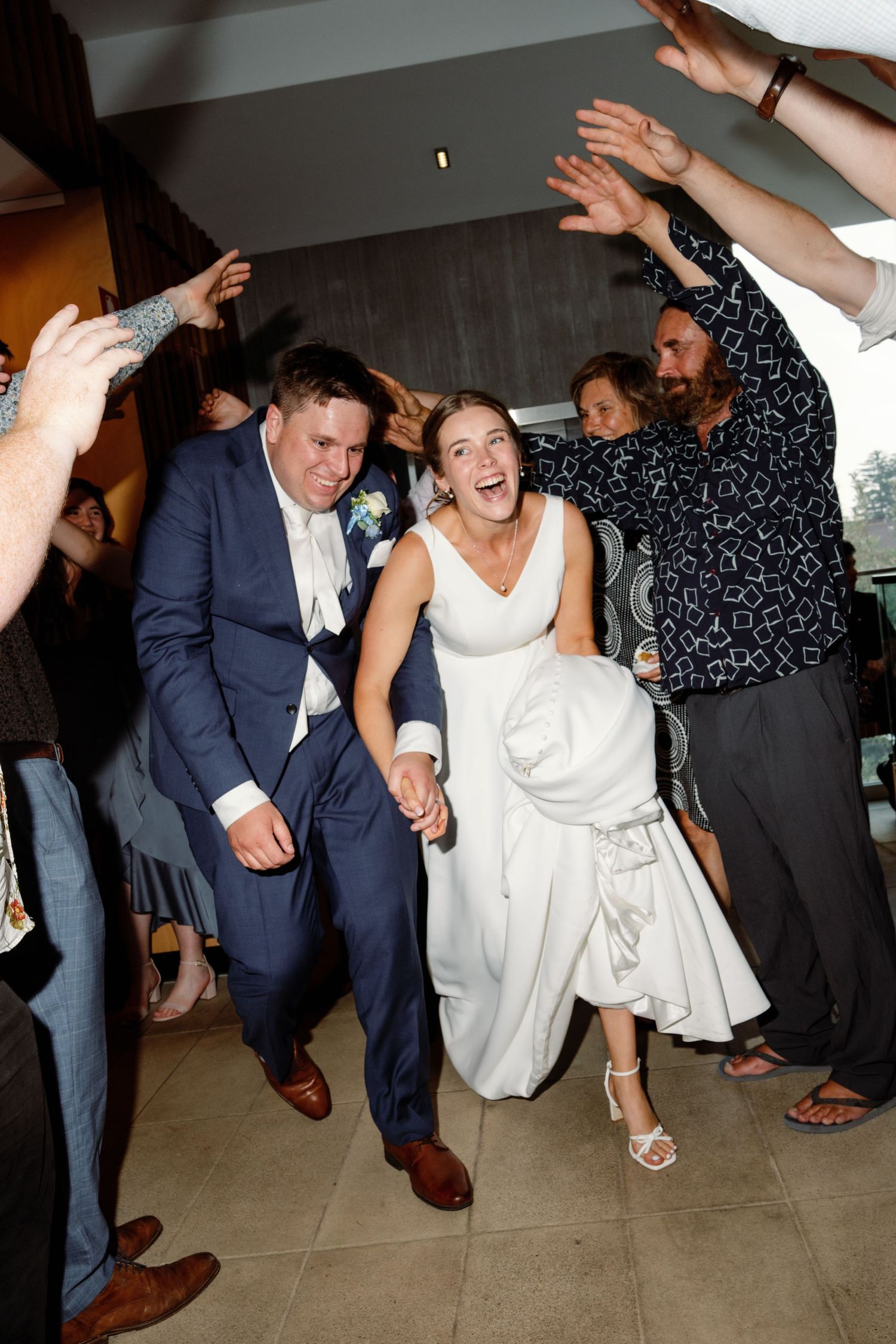 A series of energetic wedding reception dance photos showing guests celebrating on the dance floor.