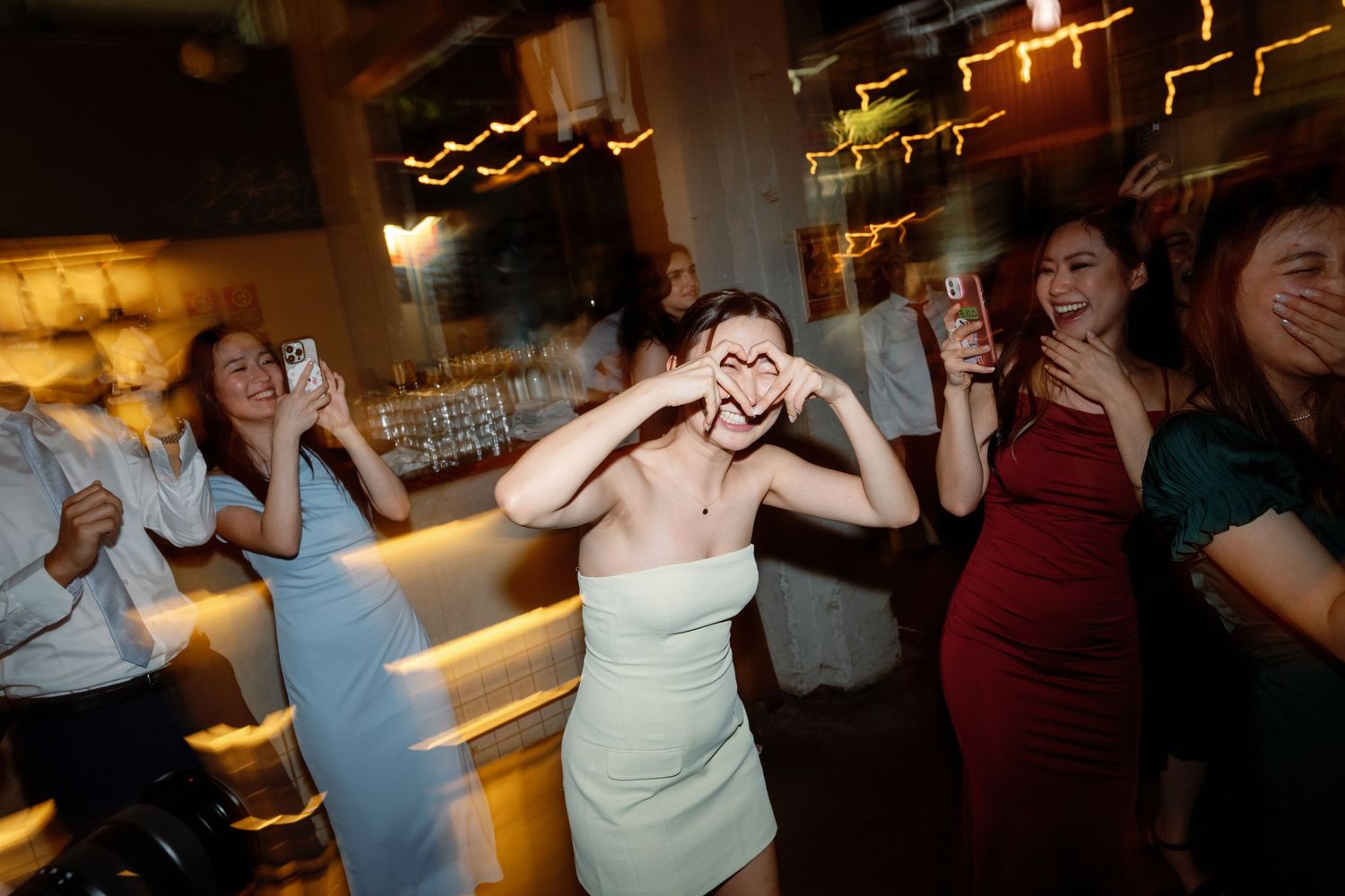 Wedding reception dance floor with celebratory party atmosphere.