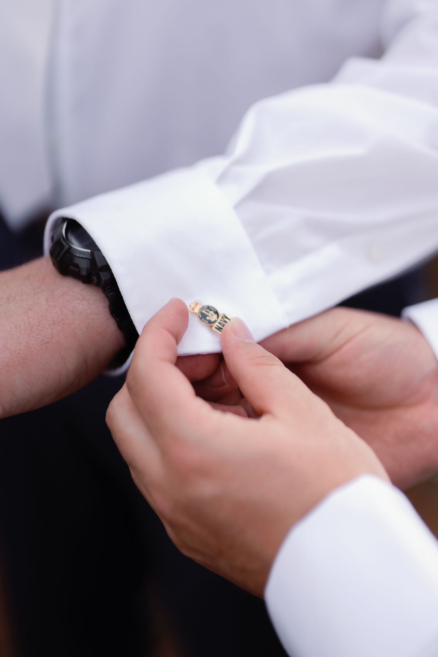 Close-up sequence showing hands exchanging wedding rings during an intimate ceremony moment.