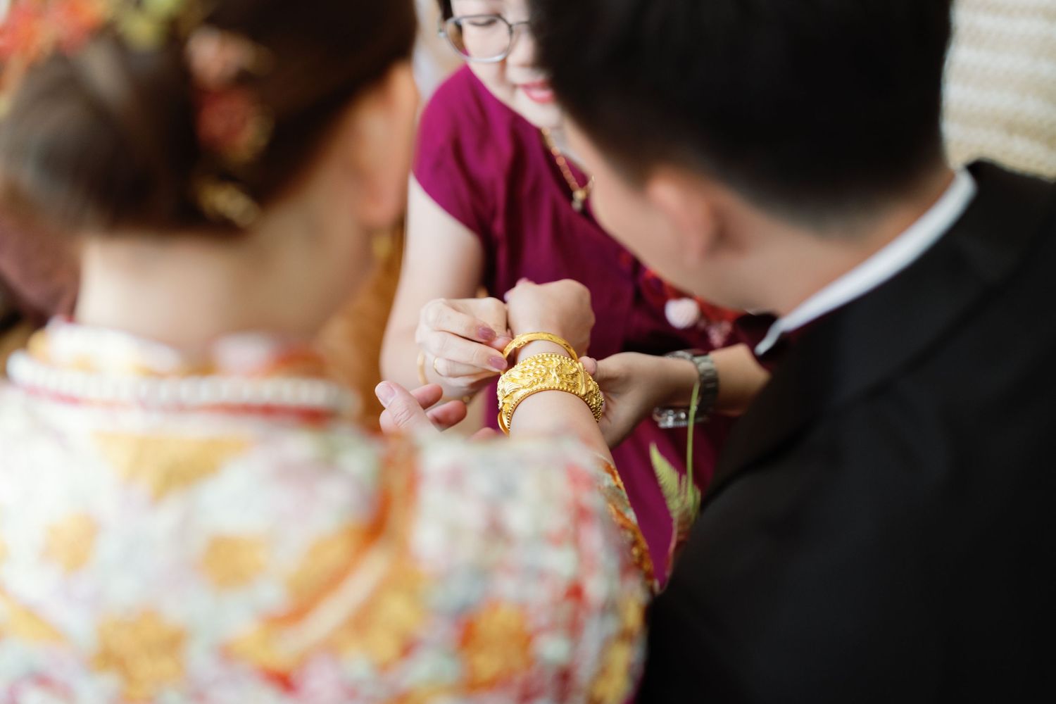 Close-up details of wedding attire and accessories in soft natural light.