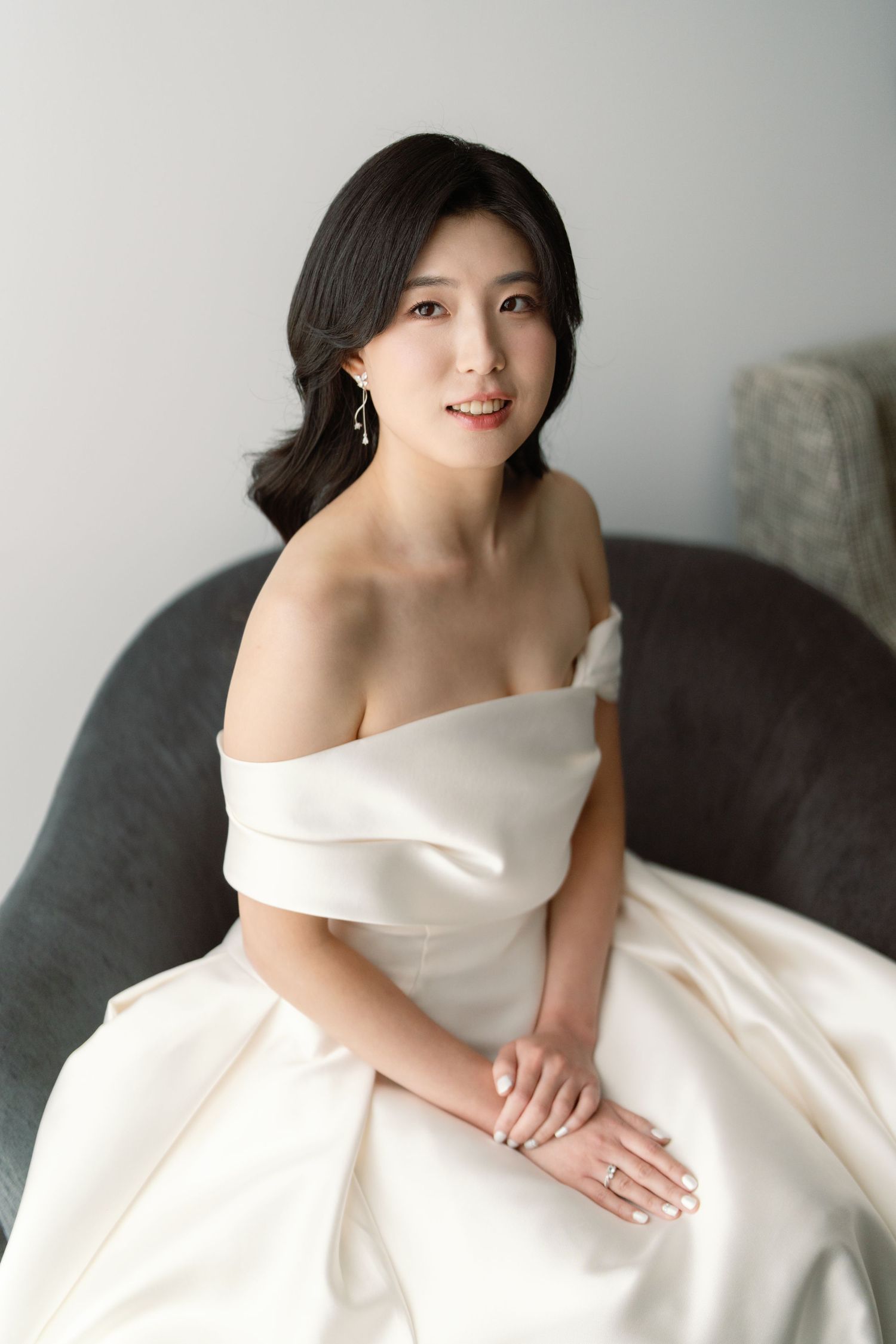 Elegant bridal portraits showing a woman in a white wedding dress against a light background.