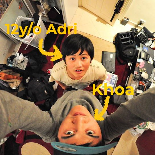 Two people pose in a playful selfie showing them lying on the floor in opposite directions.