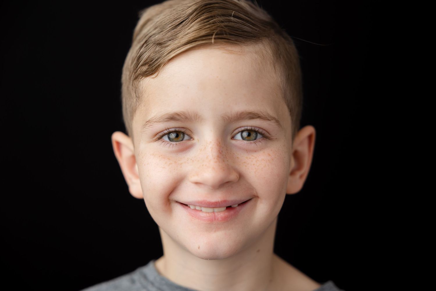 Split image showing different close-up portrait shots against a dark background with joyful expressions.