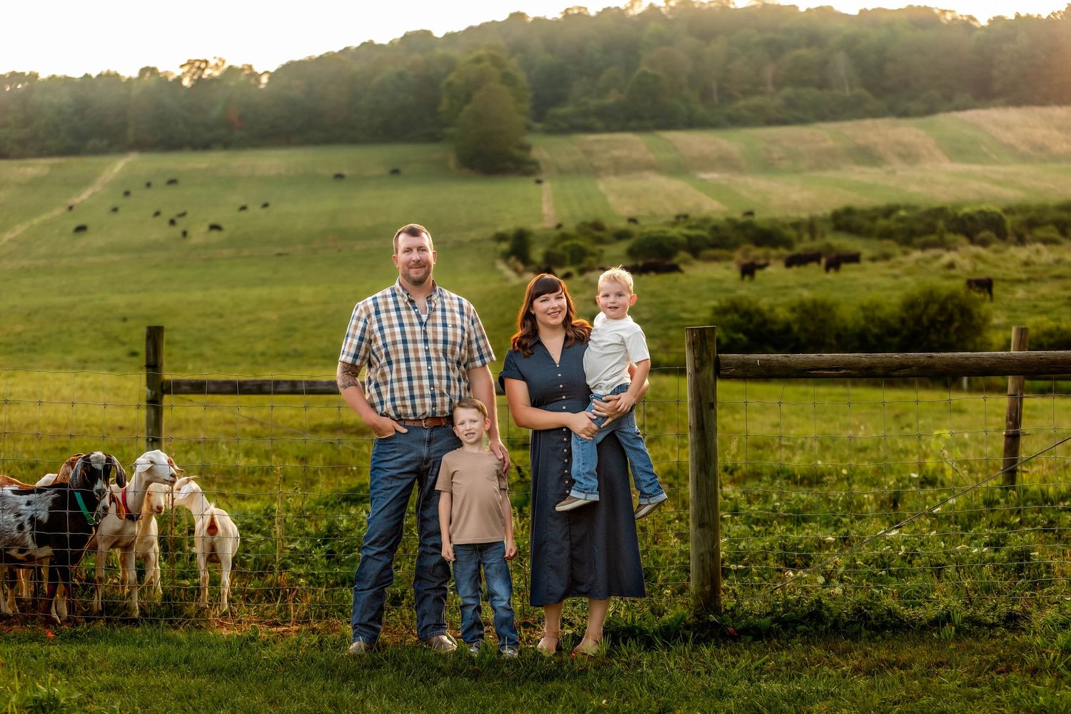 Family photos at a farm in upstate new York. Parents and kids with their farm animals with country setting