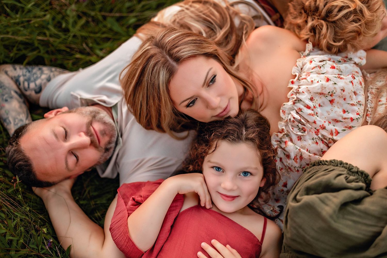Parents and kids cuddling with each other in pretty dresses