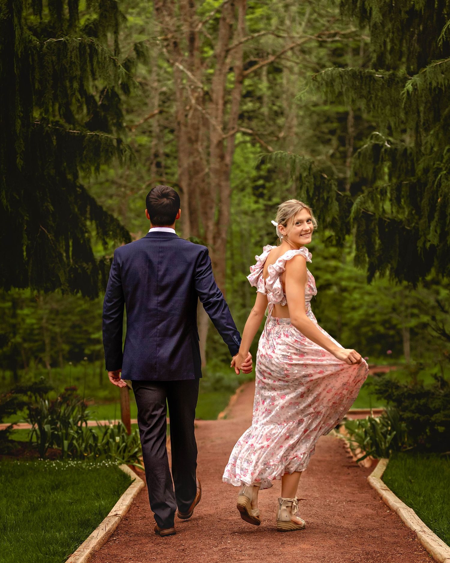 Woman twirling her dress during engagement photos in Central NY