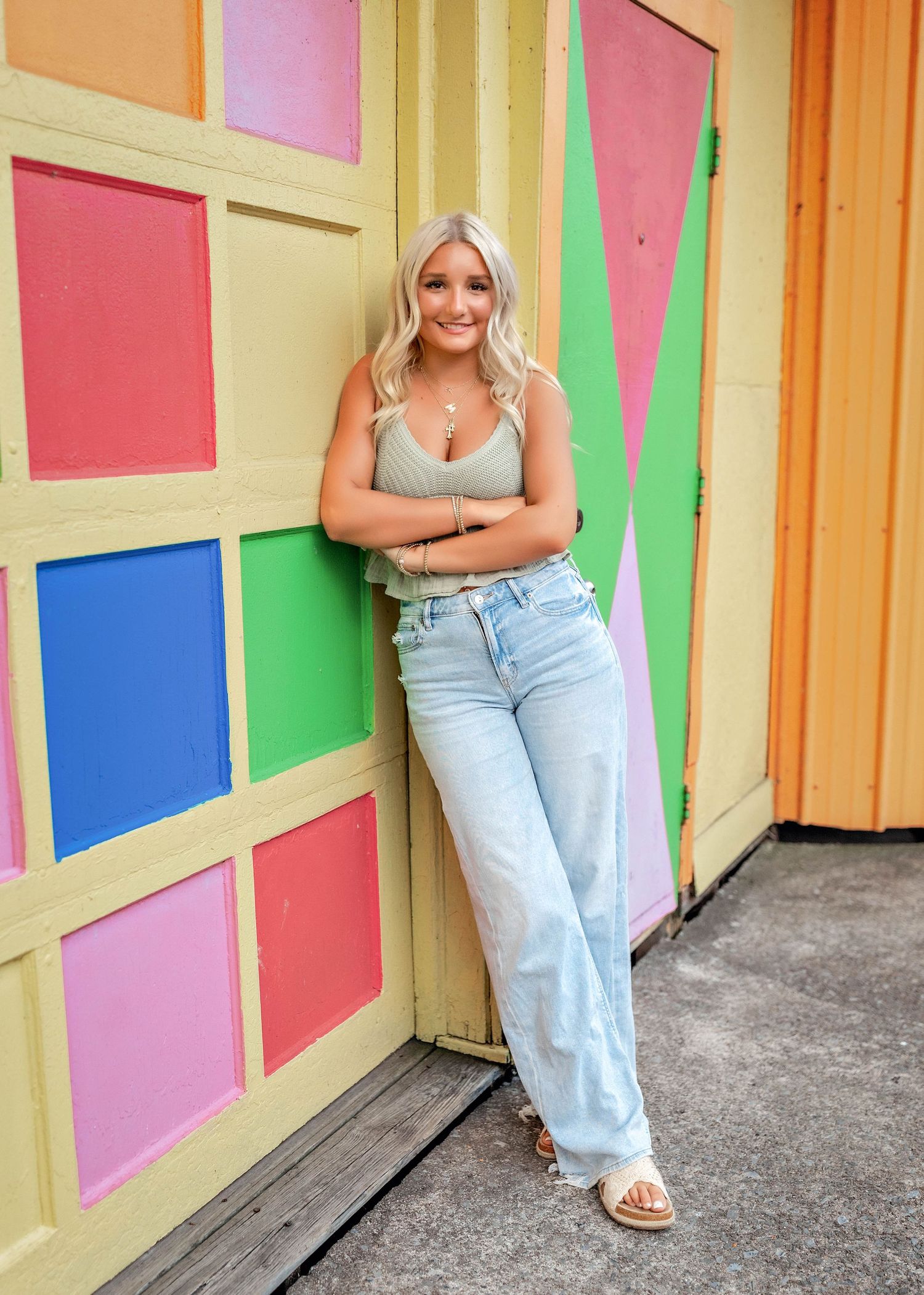 Senior photo at a carnival with colorful background in Central NY