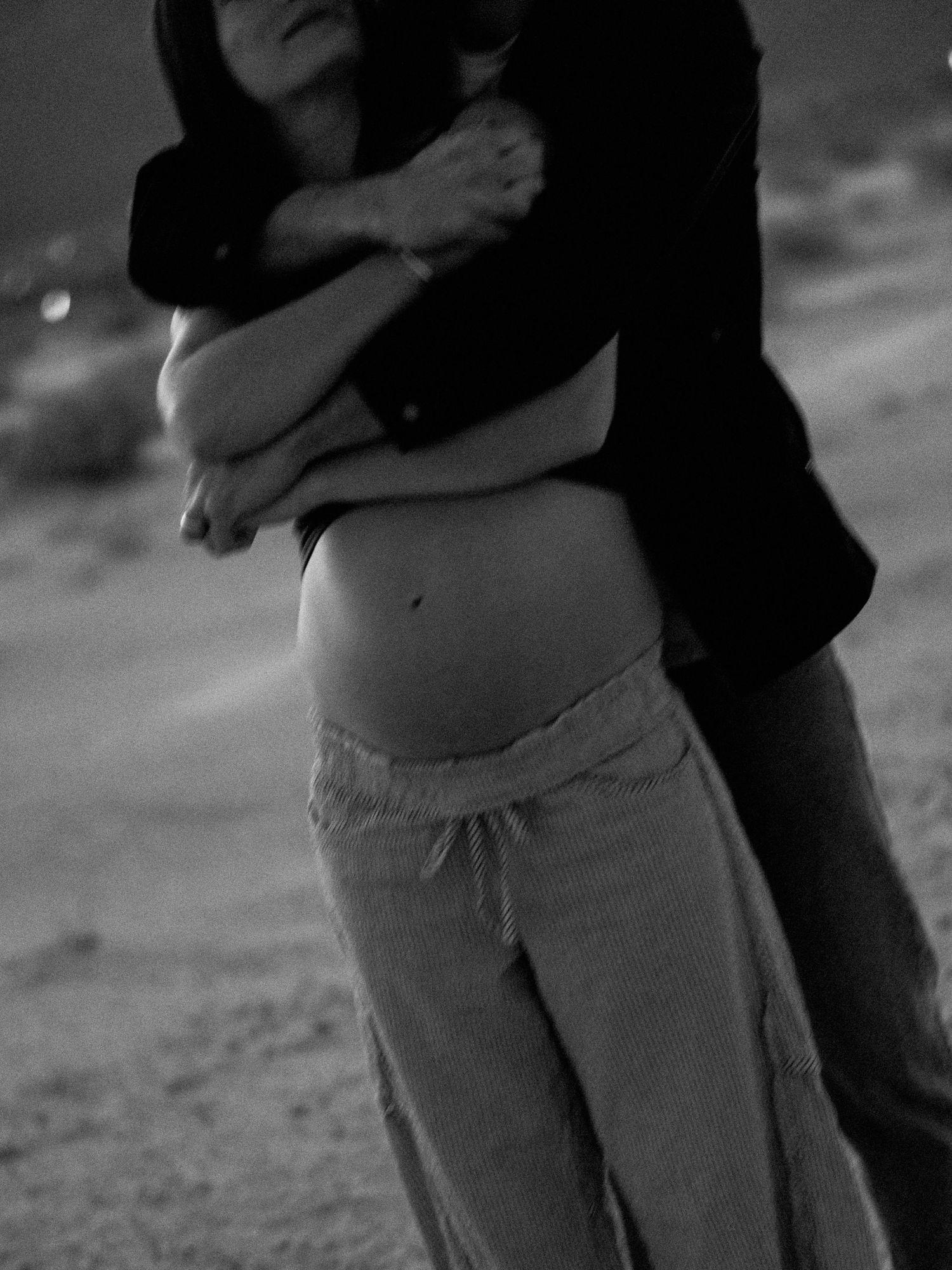 Black and white intimate moment captured in desert setting.