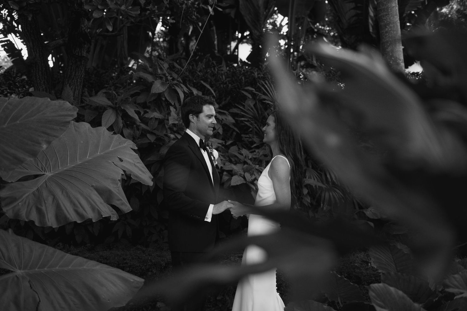 A series of black and white photos showing a couple dancing in an intimate moment.