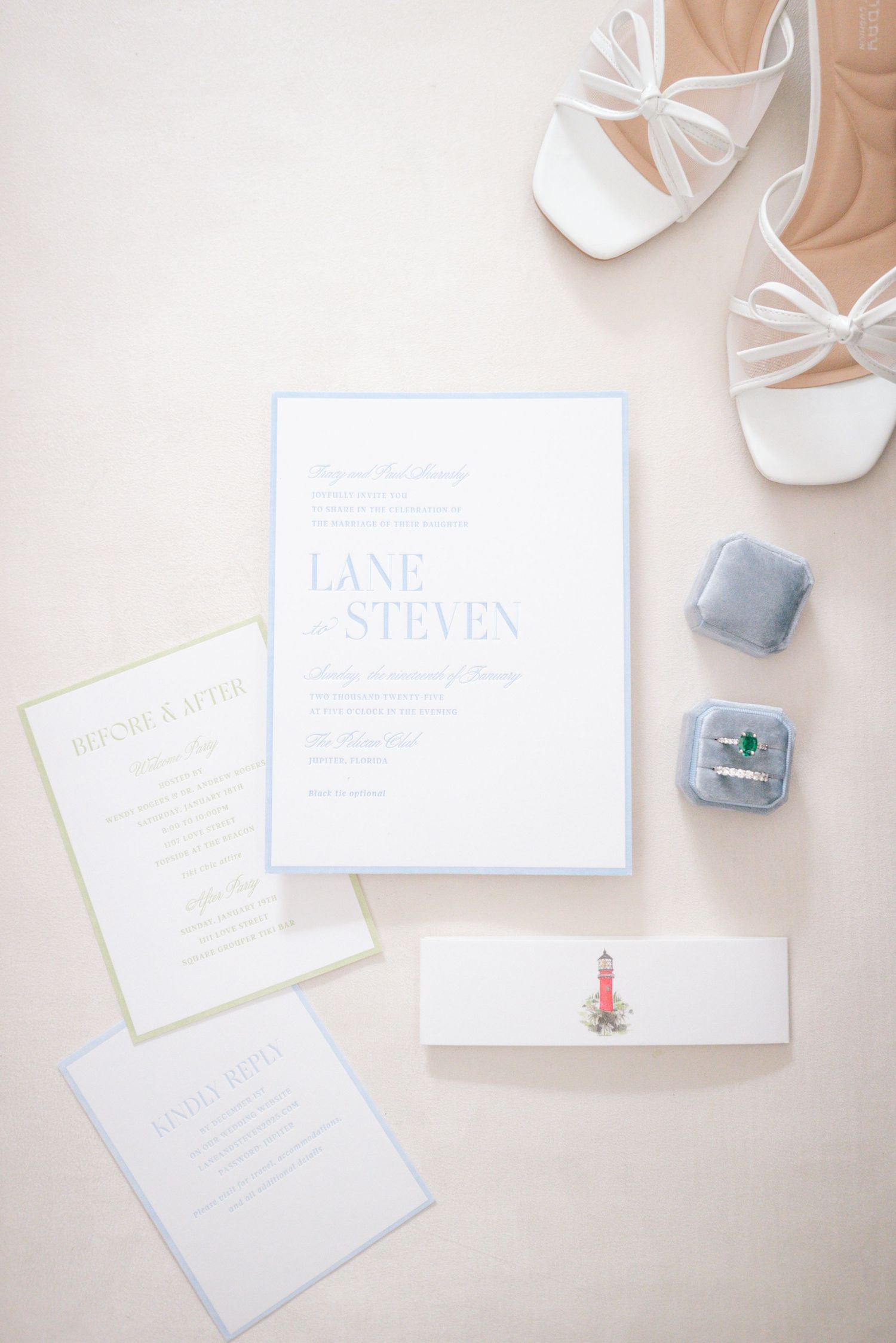 Wedding invitation suite with white shoes and ring box on beige background.