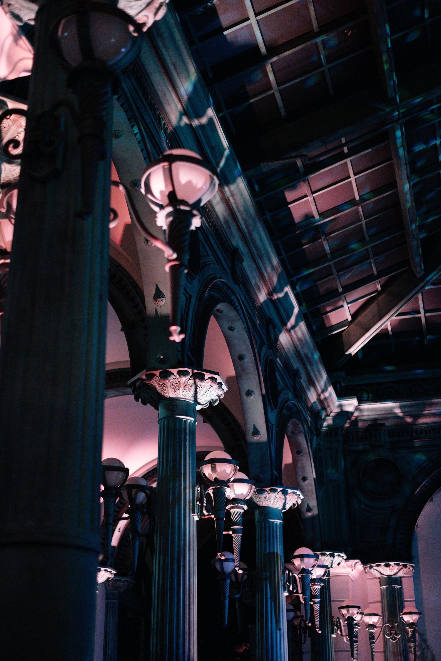 Gothic-style venue interior with dramatic lighting and architectural columns.