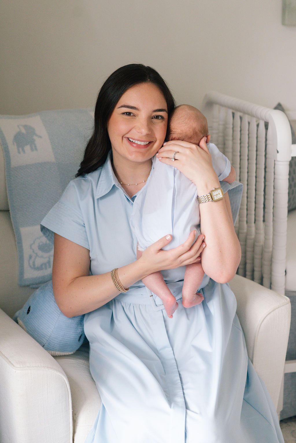 Sweet nursery moments photographed in soft light blue tones.