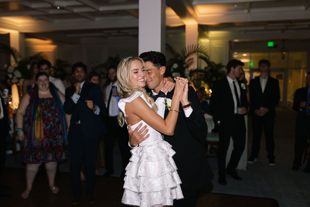 A couple shares a romantic dance moment during their wedding reception.