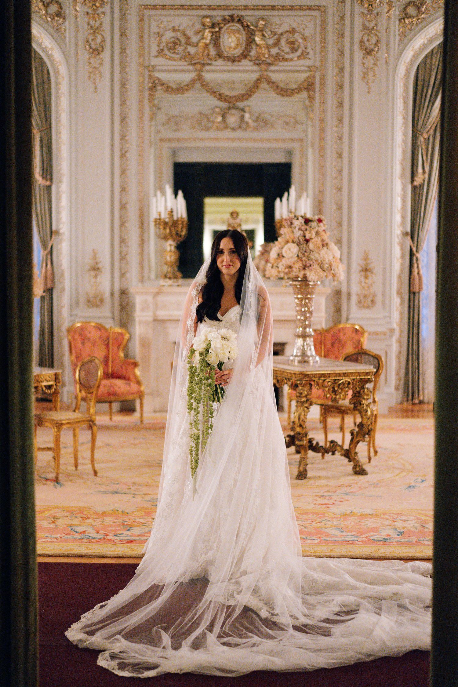 Bridal portraits in ornate gilded room featuring dramatic cathedral length veil.