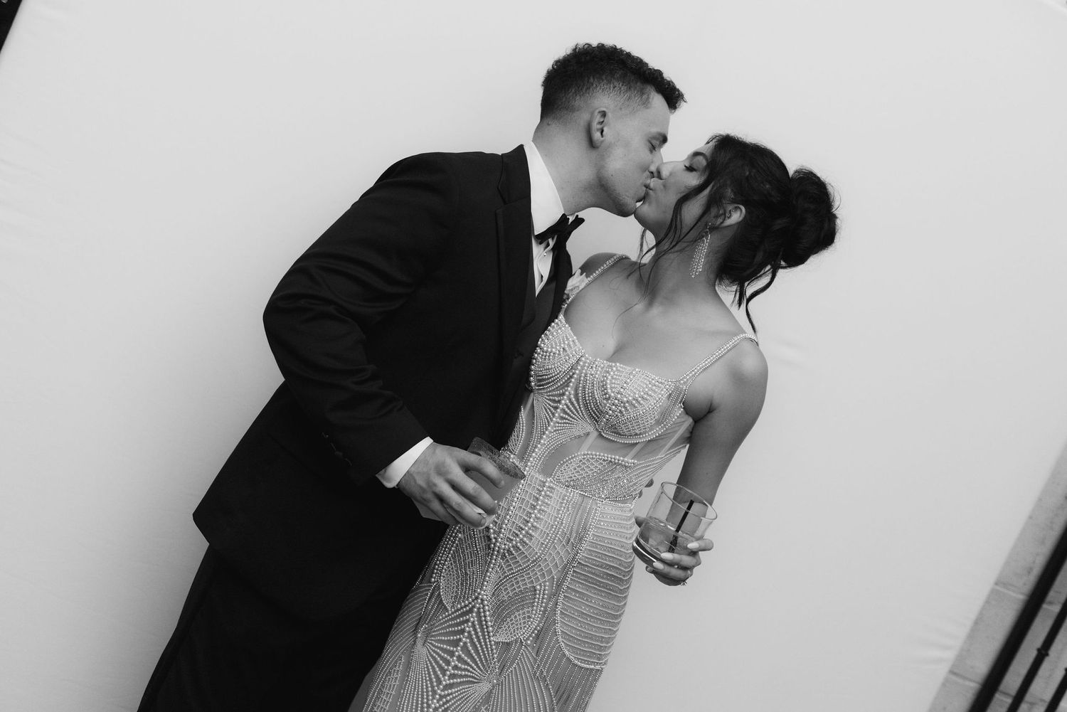 Black and white romantic portraits captured during an elegant wedding celebration.
