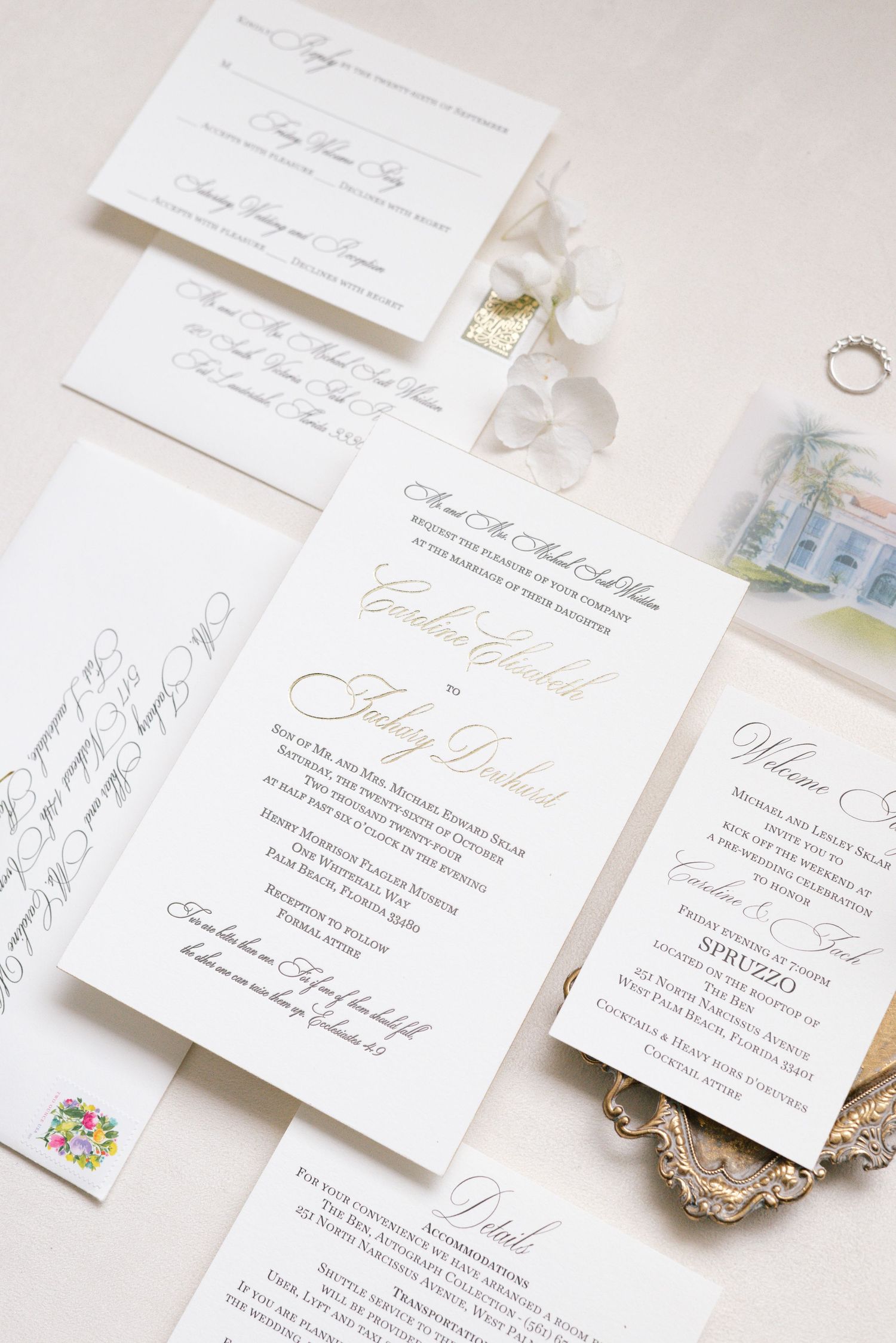 Elegant white wedding invitation suite with gold calligraphy script on cream background.