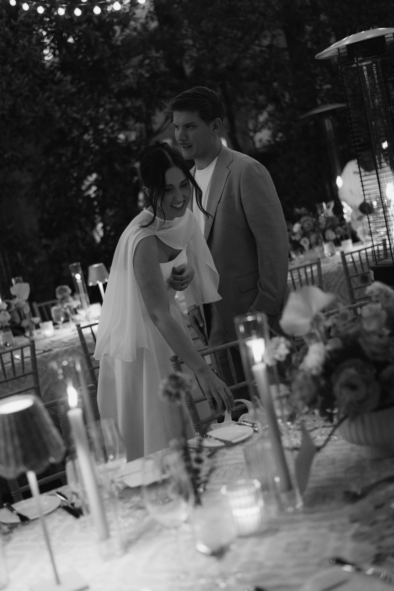 Evening outdoor celebration with string lights creating a magical atmosphere.