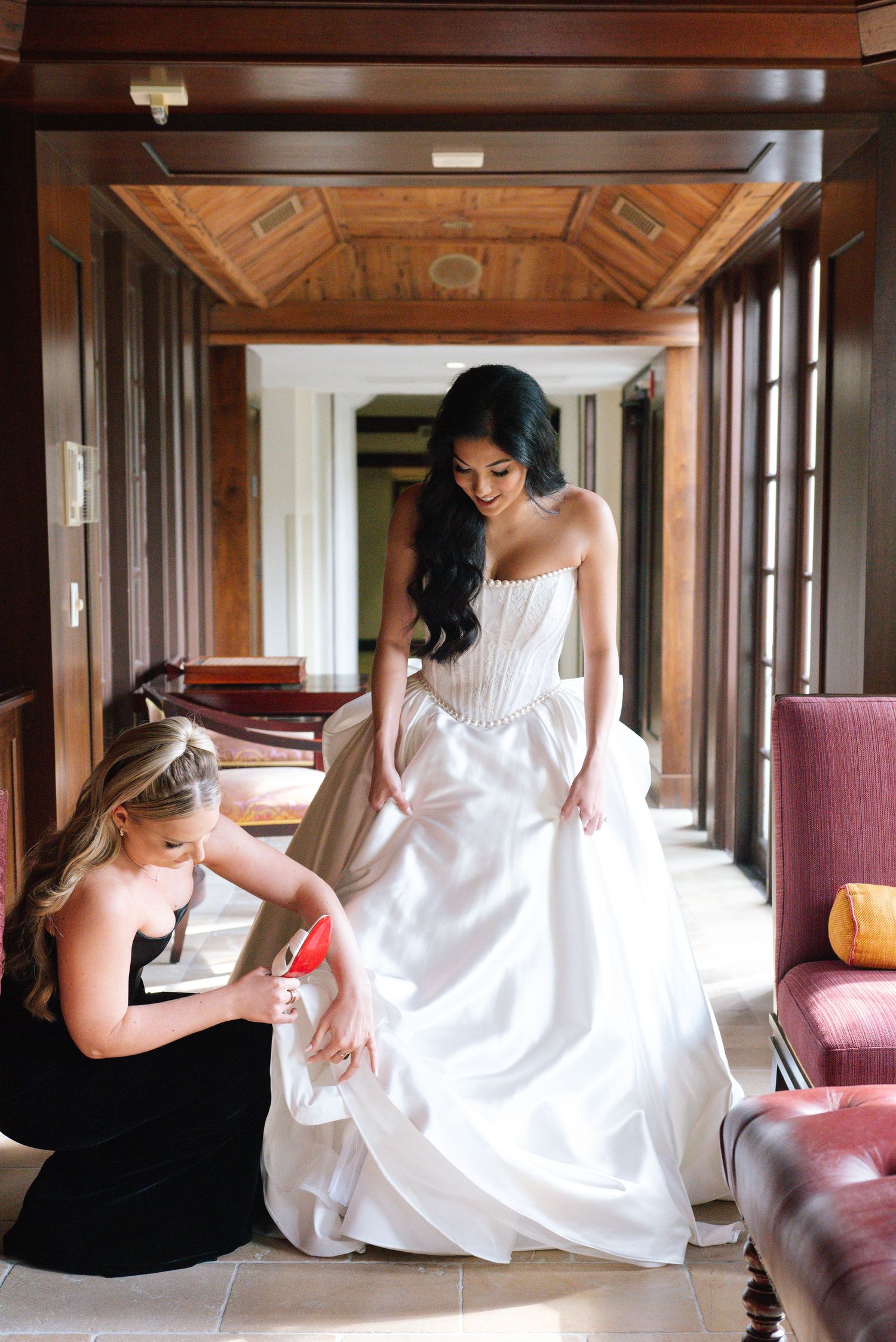 Series of artistic poses in a white dress against elegant wood-paneled hallway.