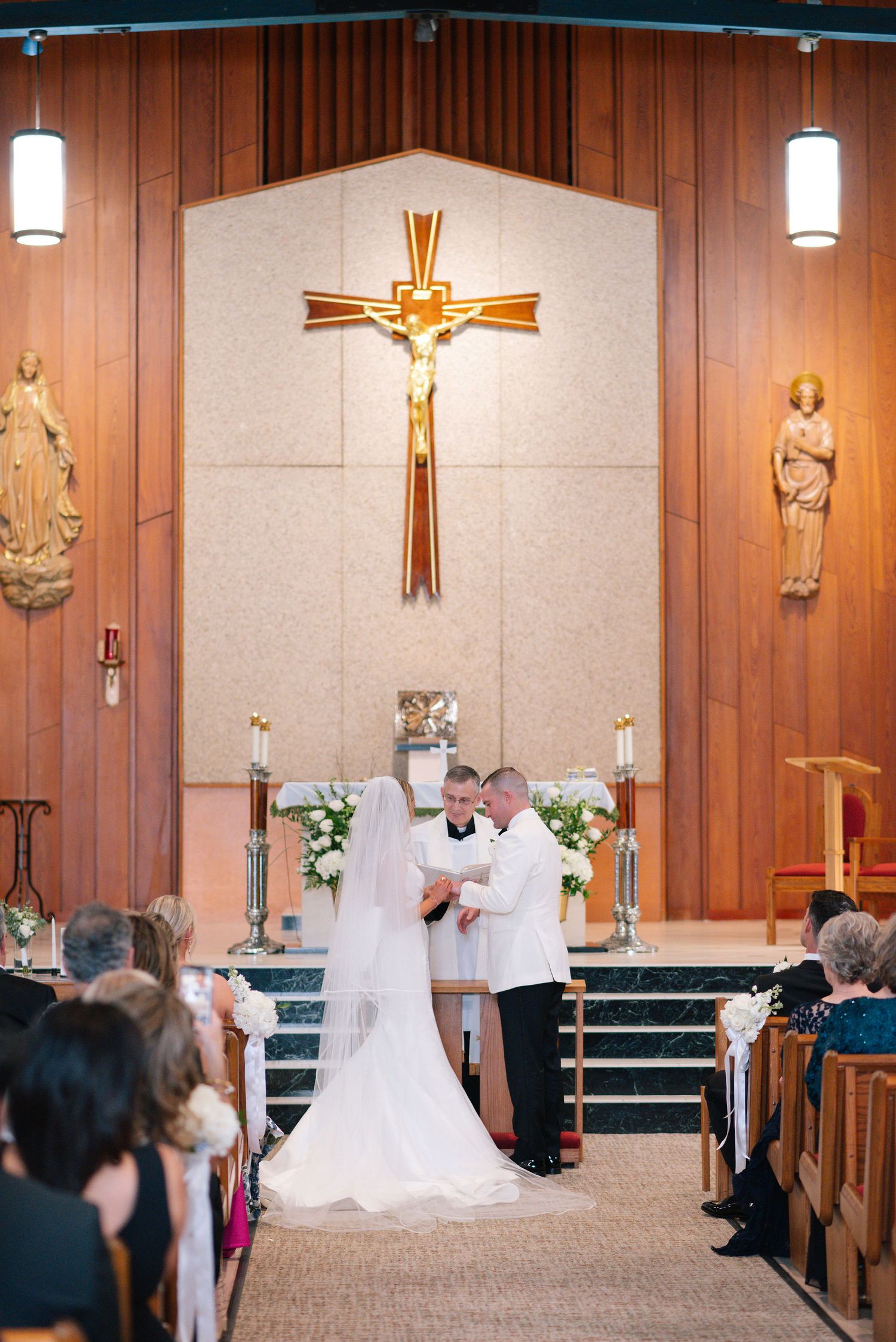 Church wedding ceremony captured in sequence showing traditional wooden interior and cross decorations.