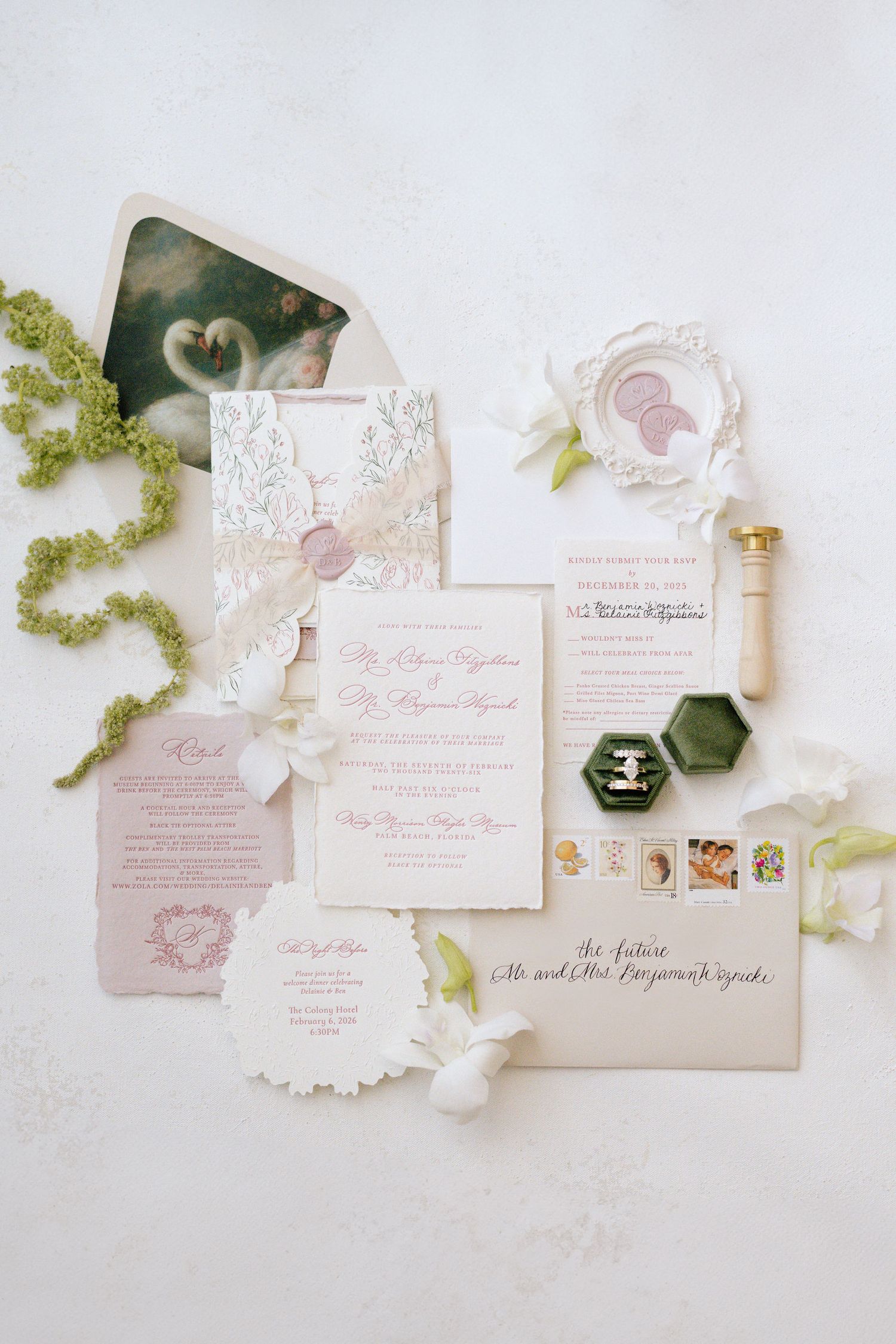 Elegant wedding invitation suite with lace details and floral designs in soft pink tones.