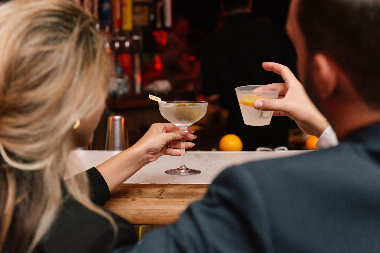 Guests enjoying cocktails and appetizers at an elegant evening event.