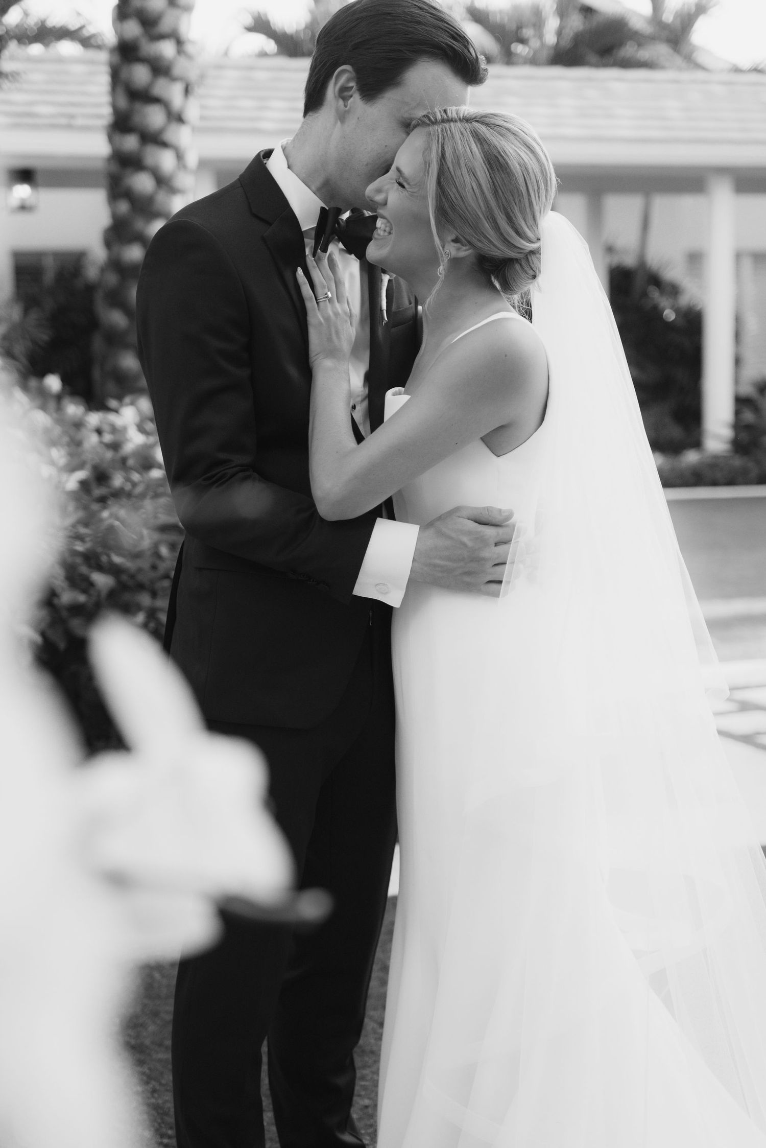 Series of intimate black and white wedding portraits capturing tender moments.