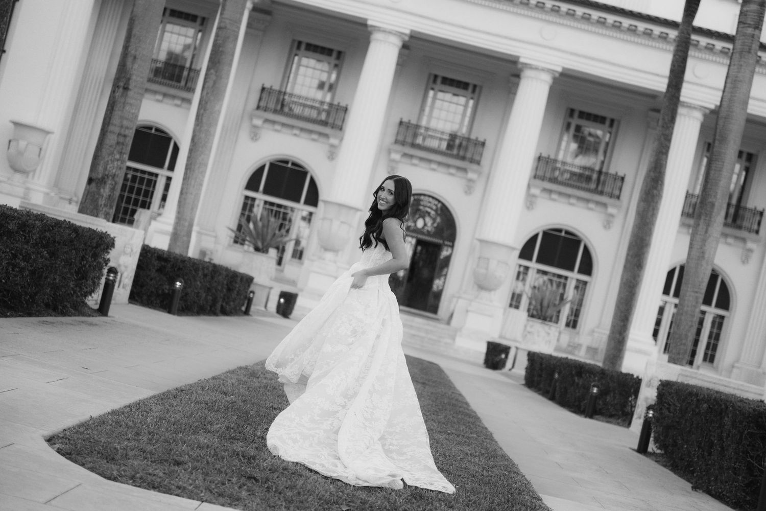Wedding photography series captured against classical white building exterior.