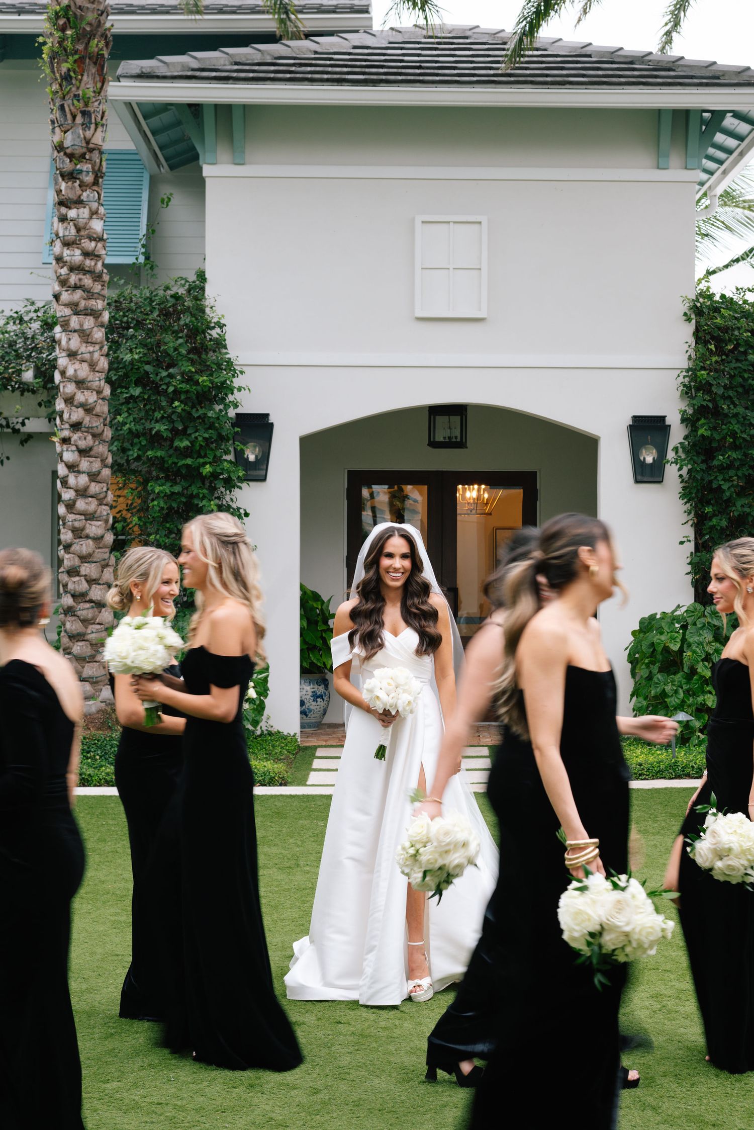 Candid moments of bridal party laughing and posing together on venue lawn.