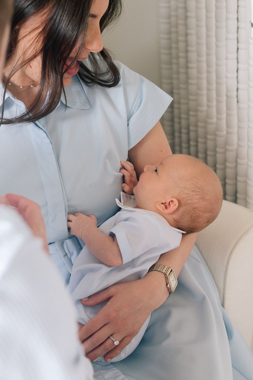 Gentle moments photographed in soft natural light with blue and white tones.
