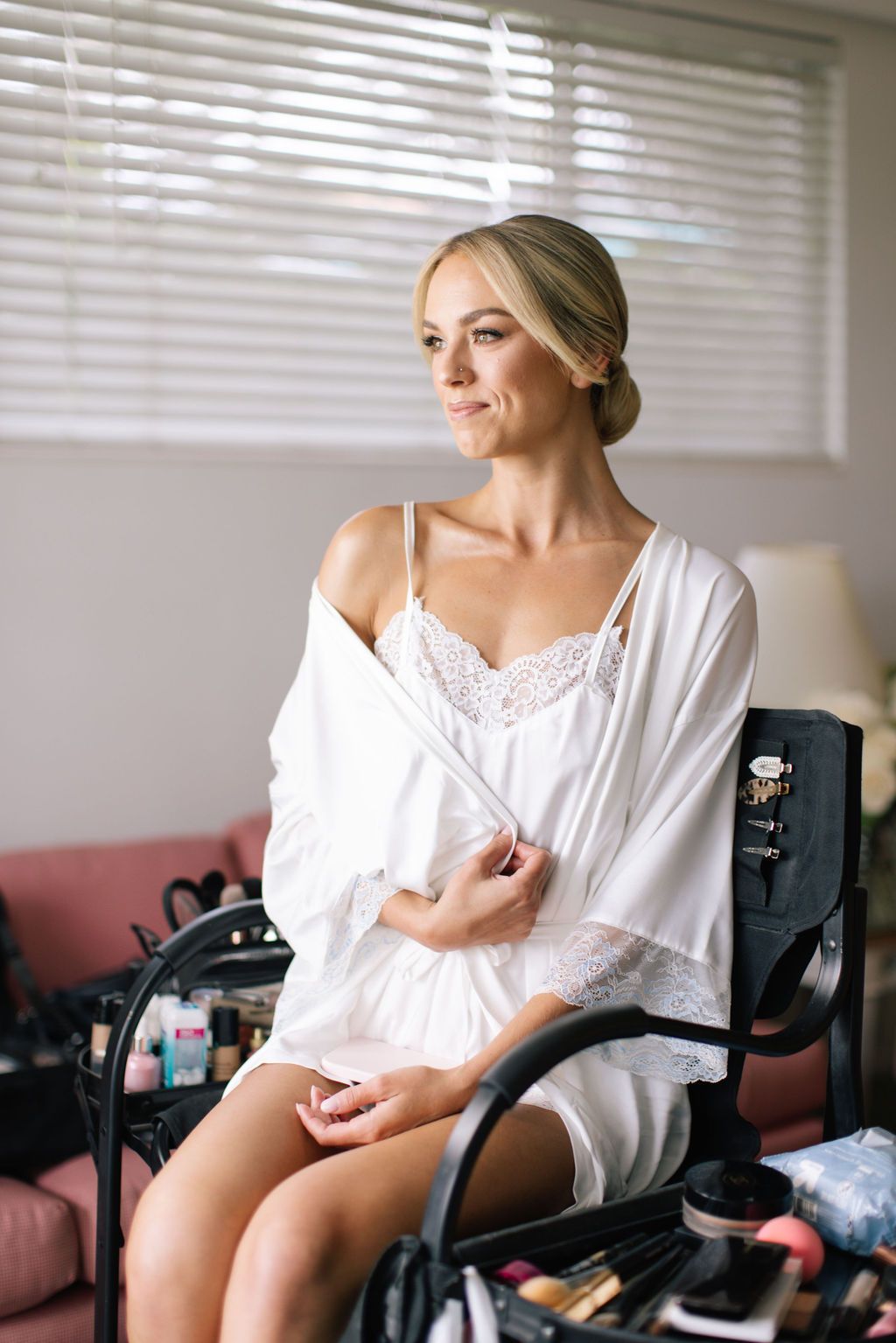 Elegant preparation moments captured in bright interior setting.