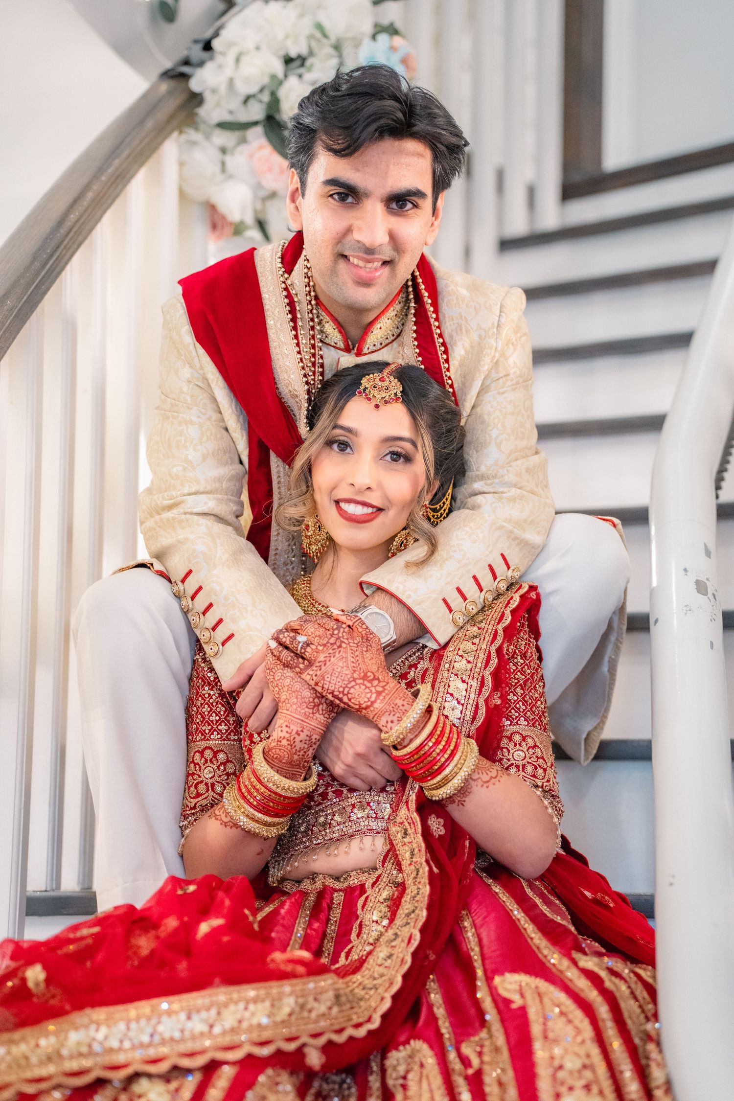 Couples hugging each other on the stair in traditional clothing