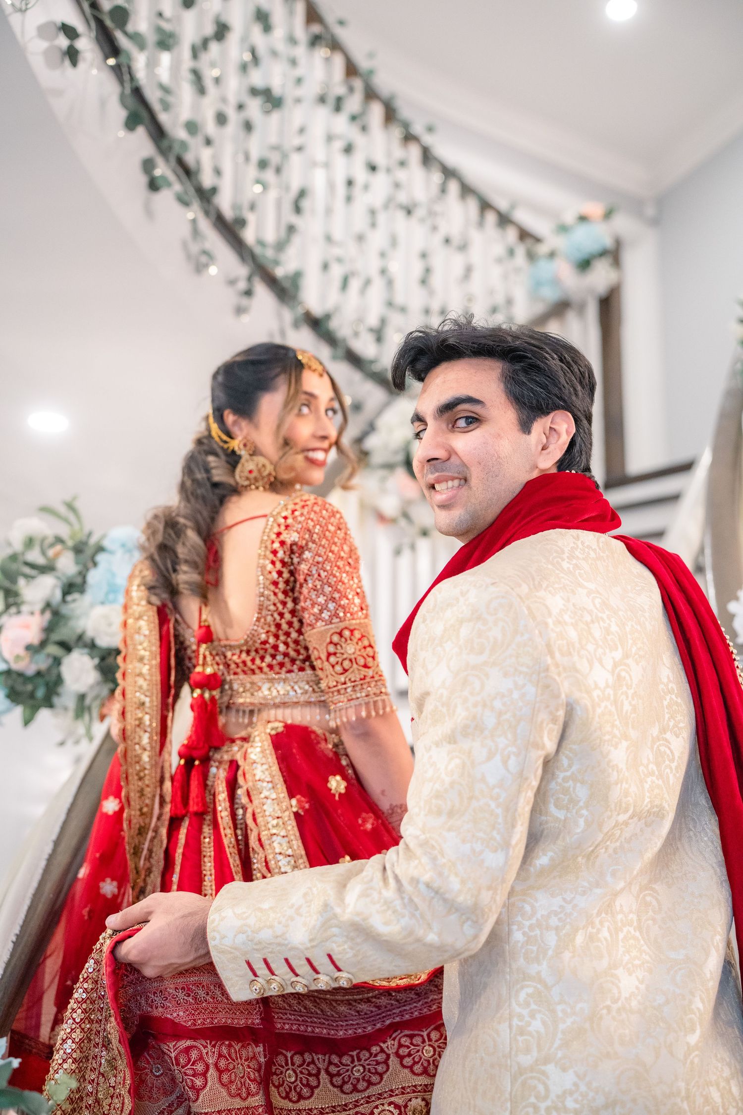 Groom holding the bride's traditional dress