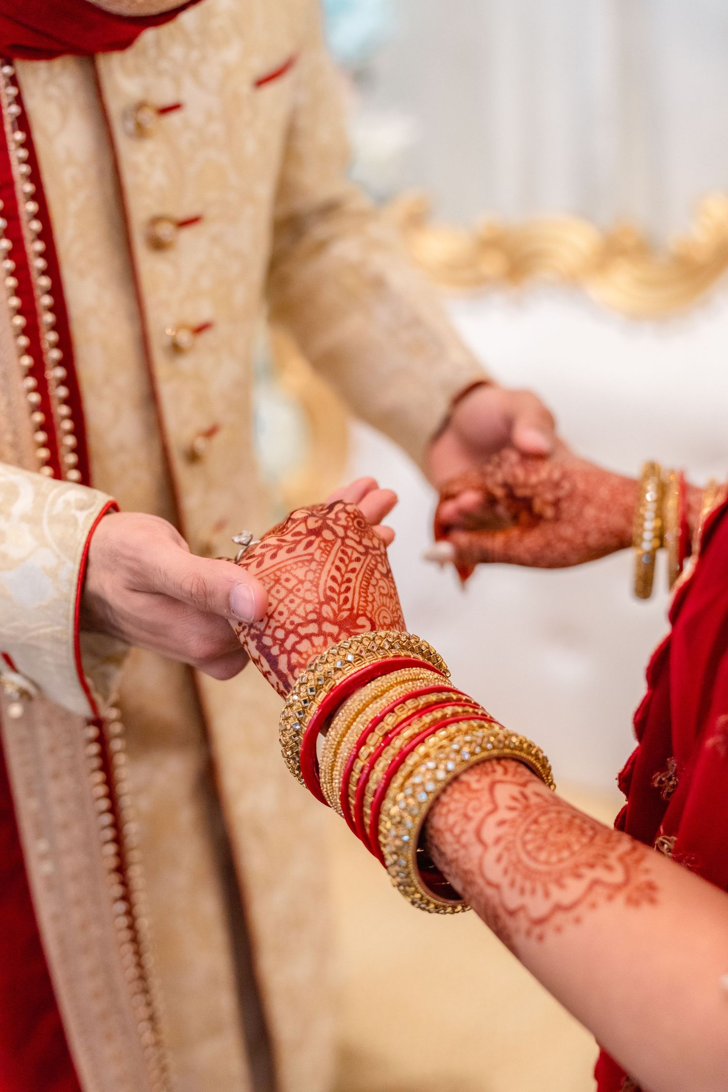 Groom and Bride holding hand in their traditional wedding clothing
