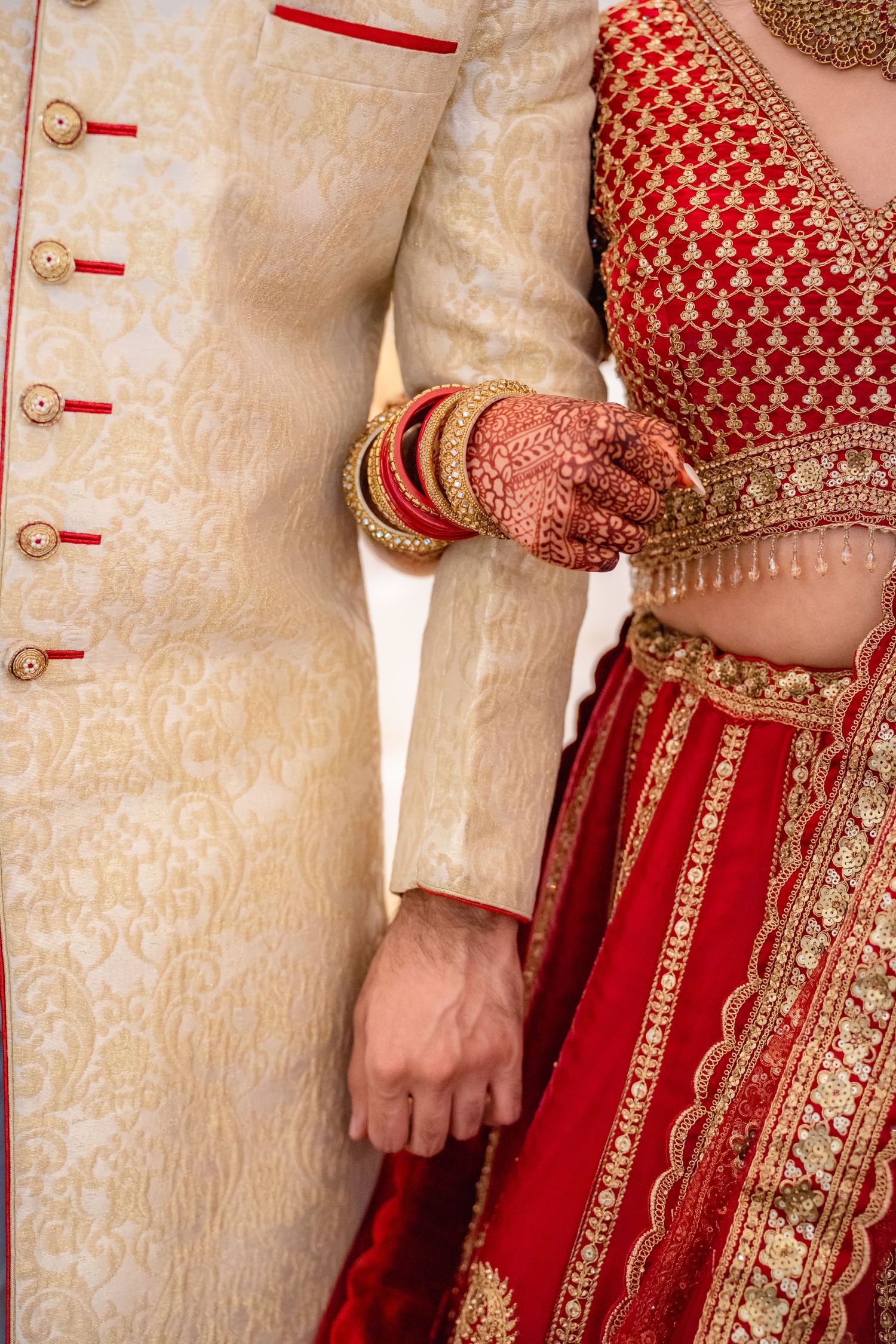 Groom and Bride corss hand in their traditional clothing