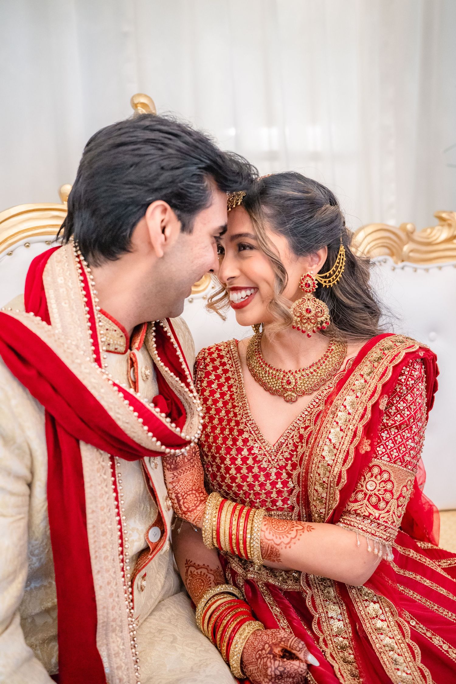 Groom and Bride admiring at each other in their traditional wedding clothing
