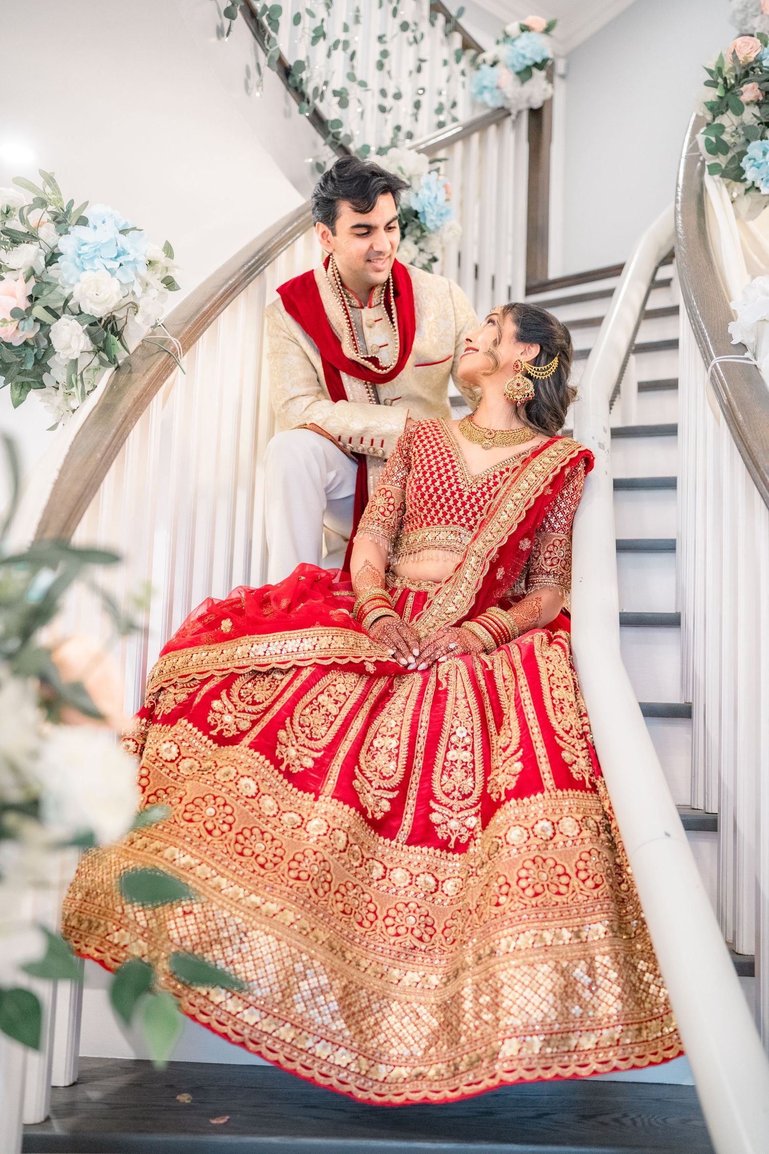 Couples smilling each other on the stair in traditional clothing