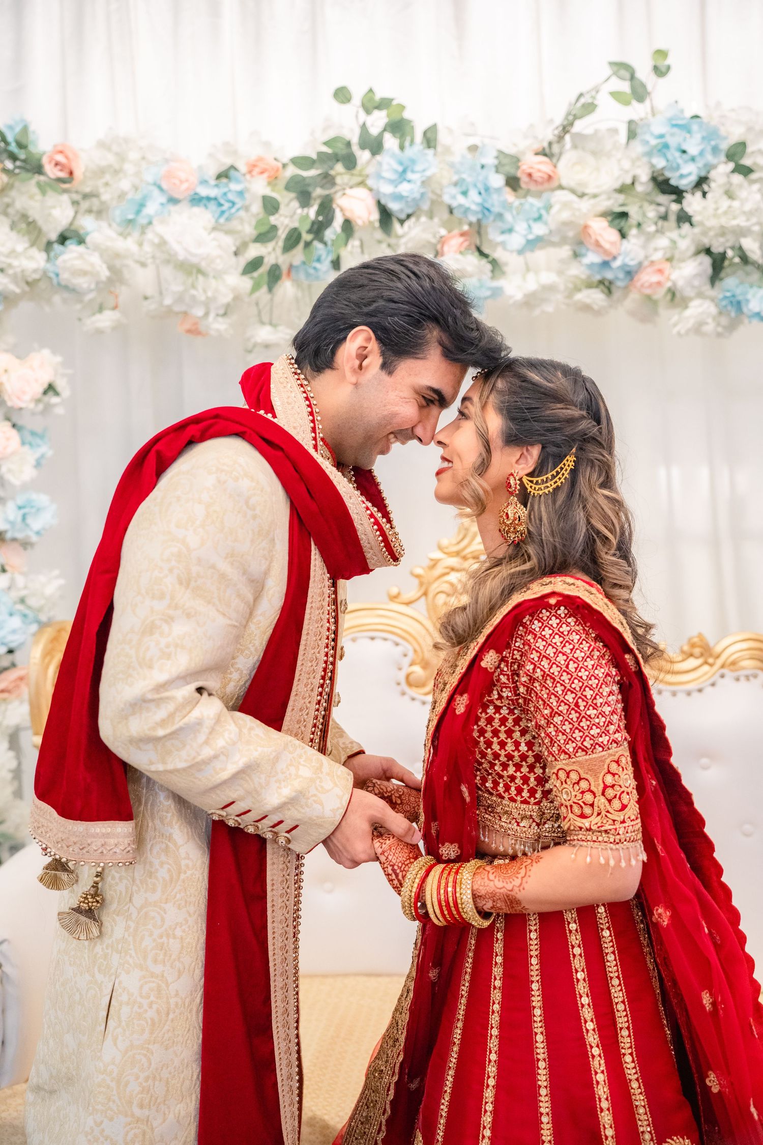 Groom and Bride holding hand in their traditional wedding clothing