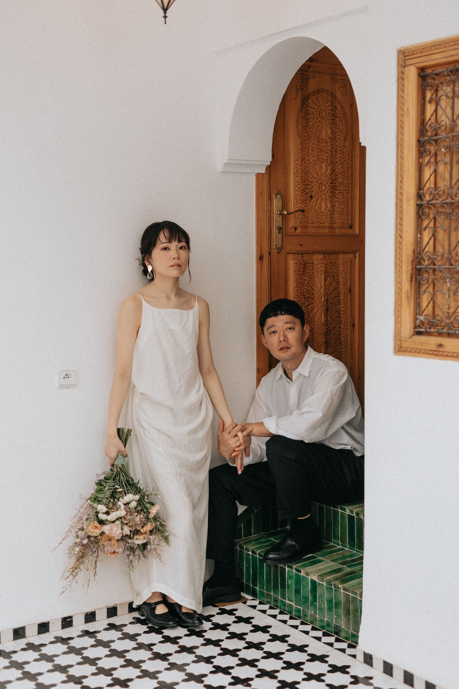 Romantic couple portrait in a Marrakech riad courtyard
