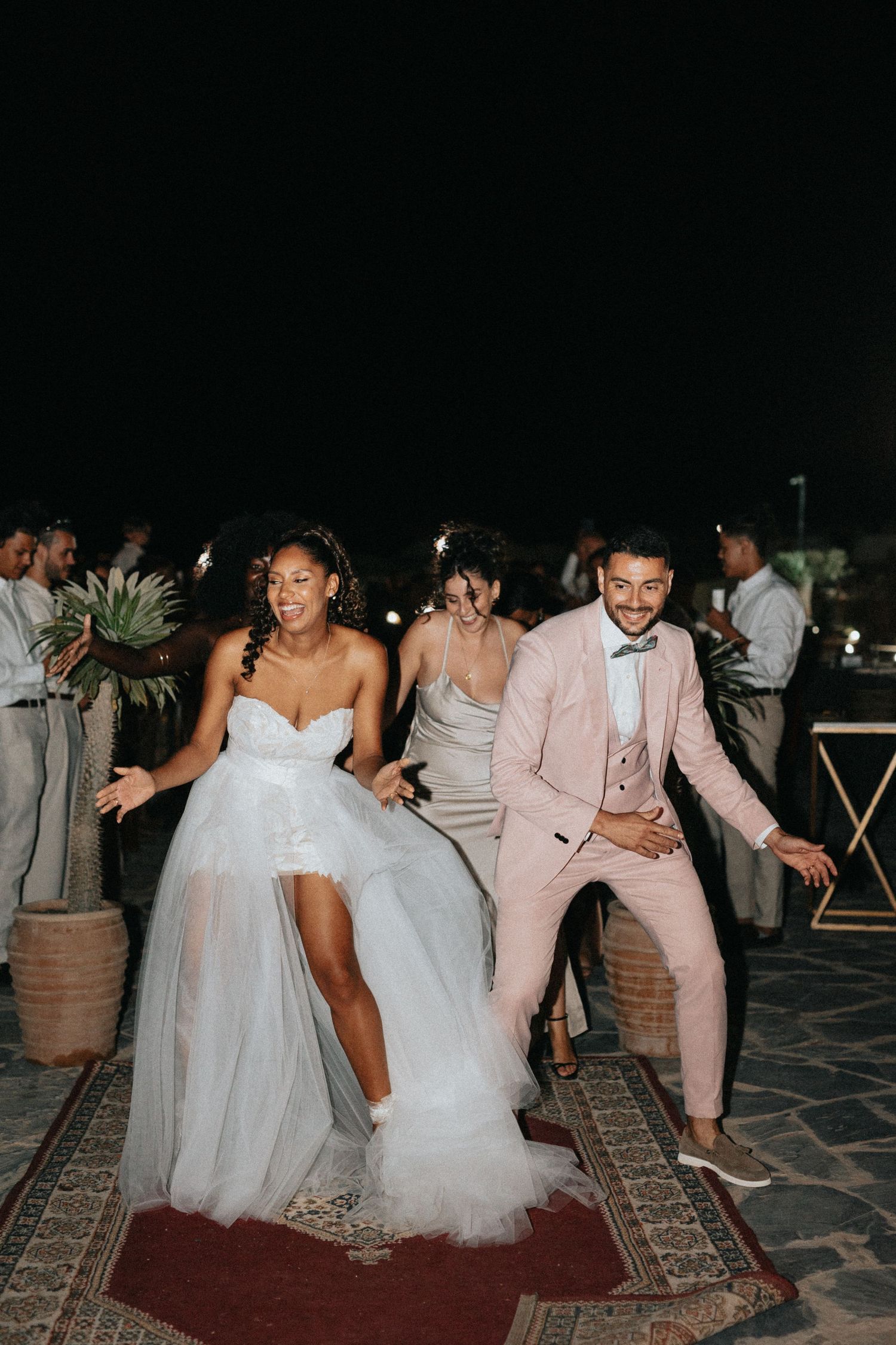 bride and groom dance in the desert of agafay