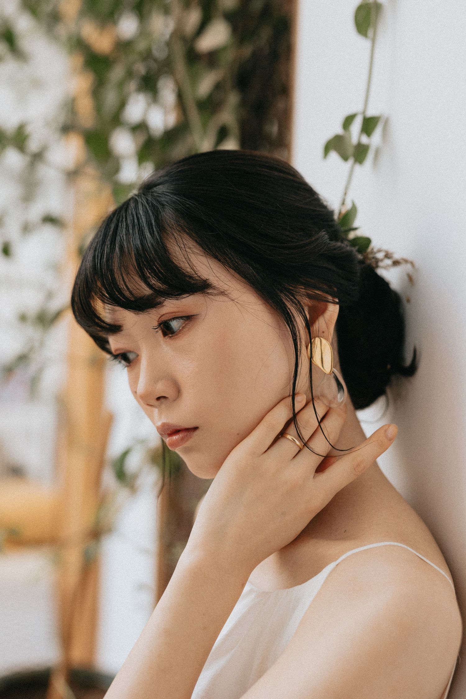 Close-up of bride’s face with dreamy, editorial-style lighting