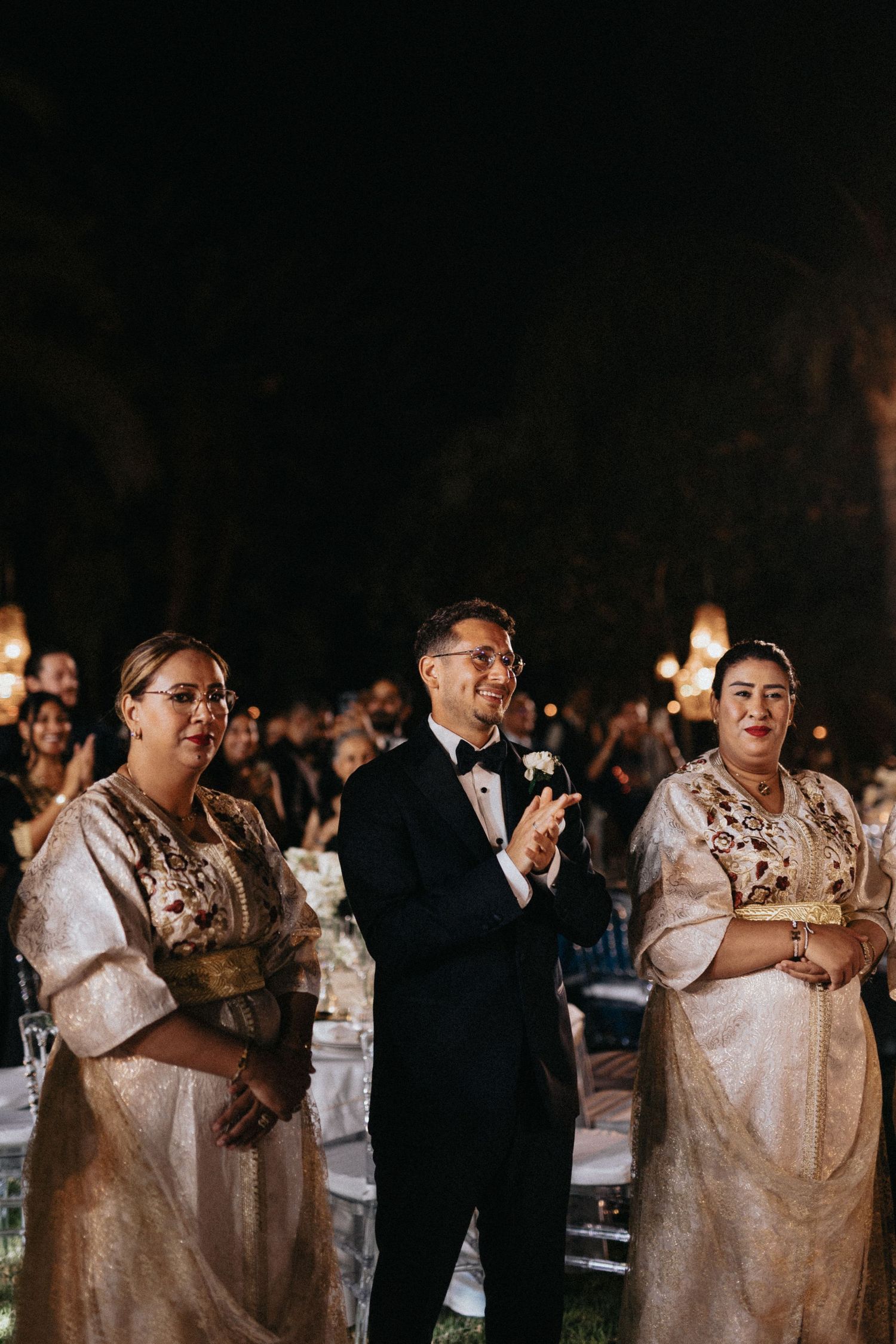 Bride and groom entering the reception on a decorated wedding platform