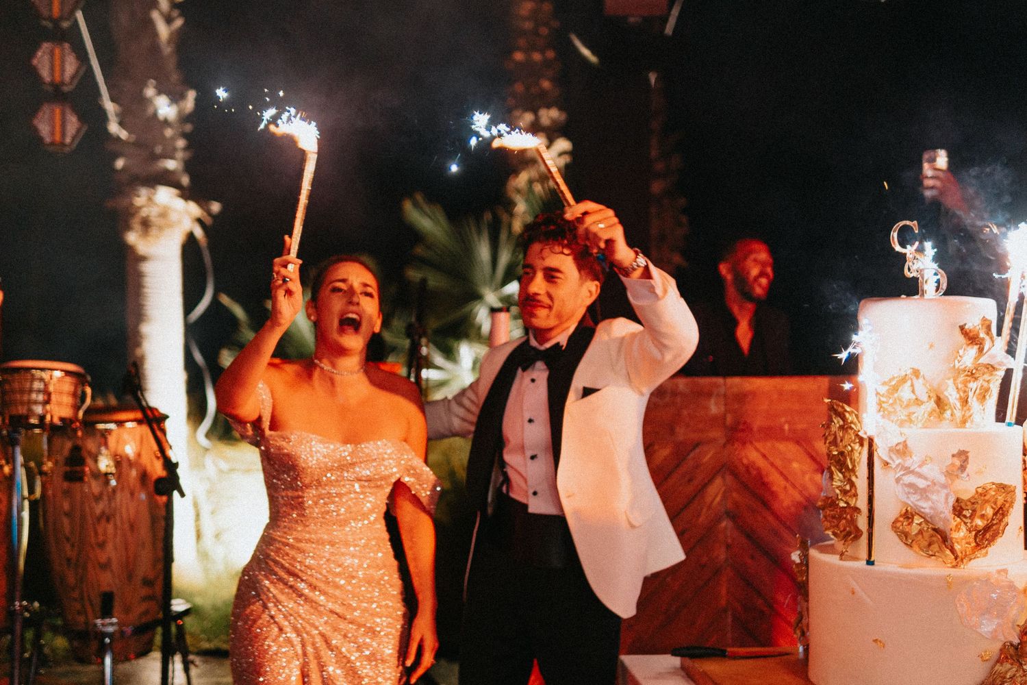 Bride and groom dancing under Moroccan night sky