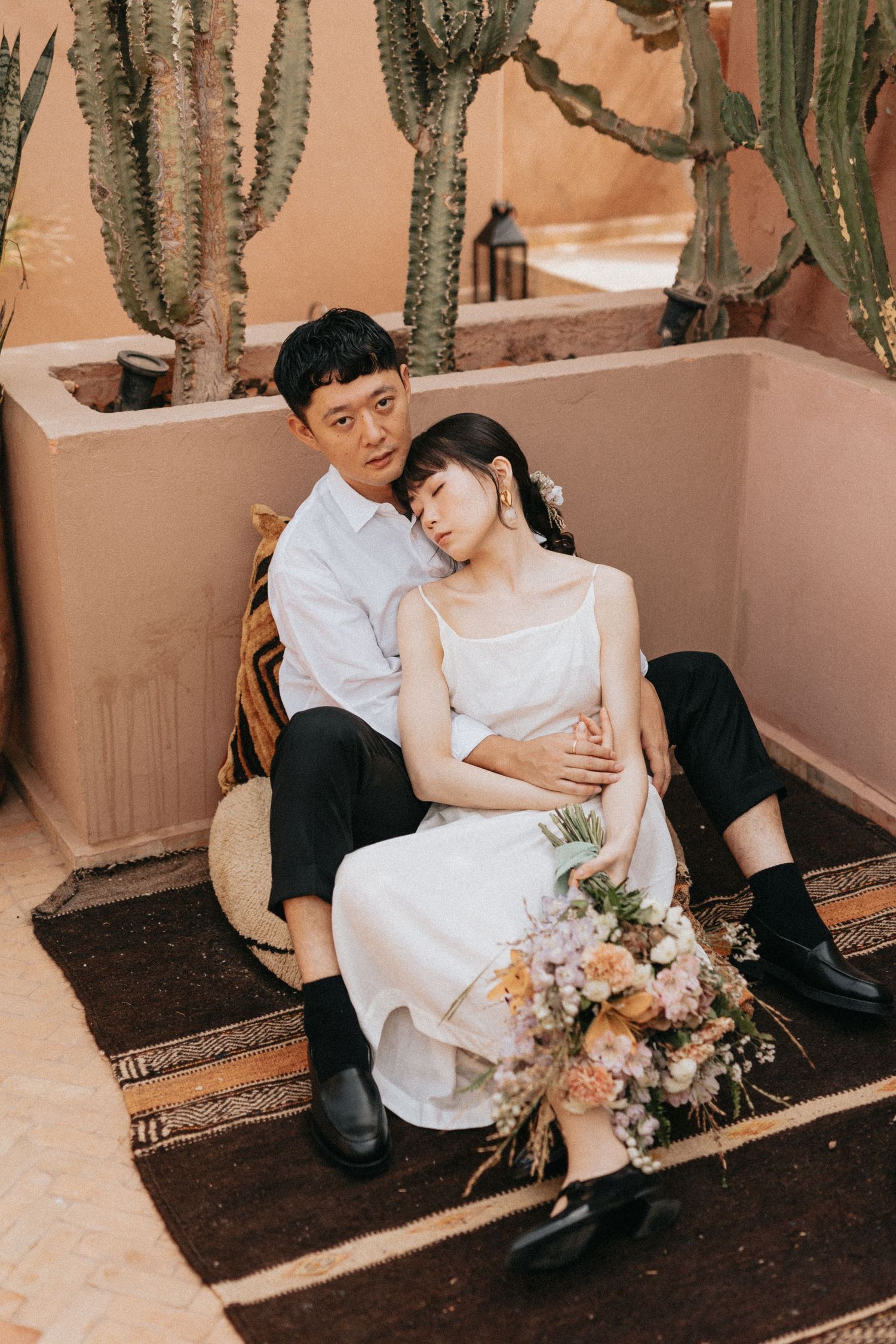 Romantic couple portrait in a Marrakech riad rooftop