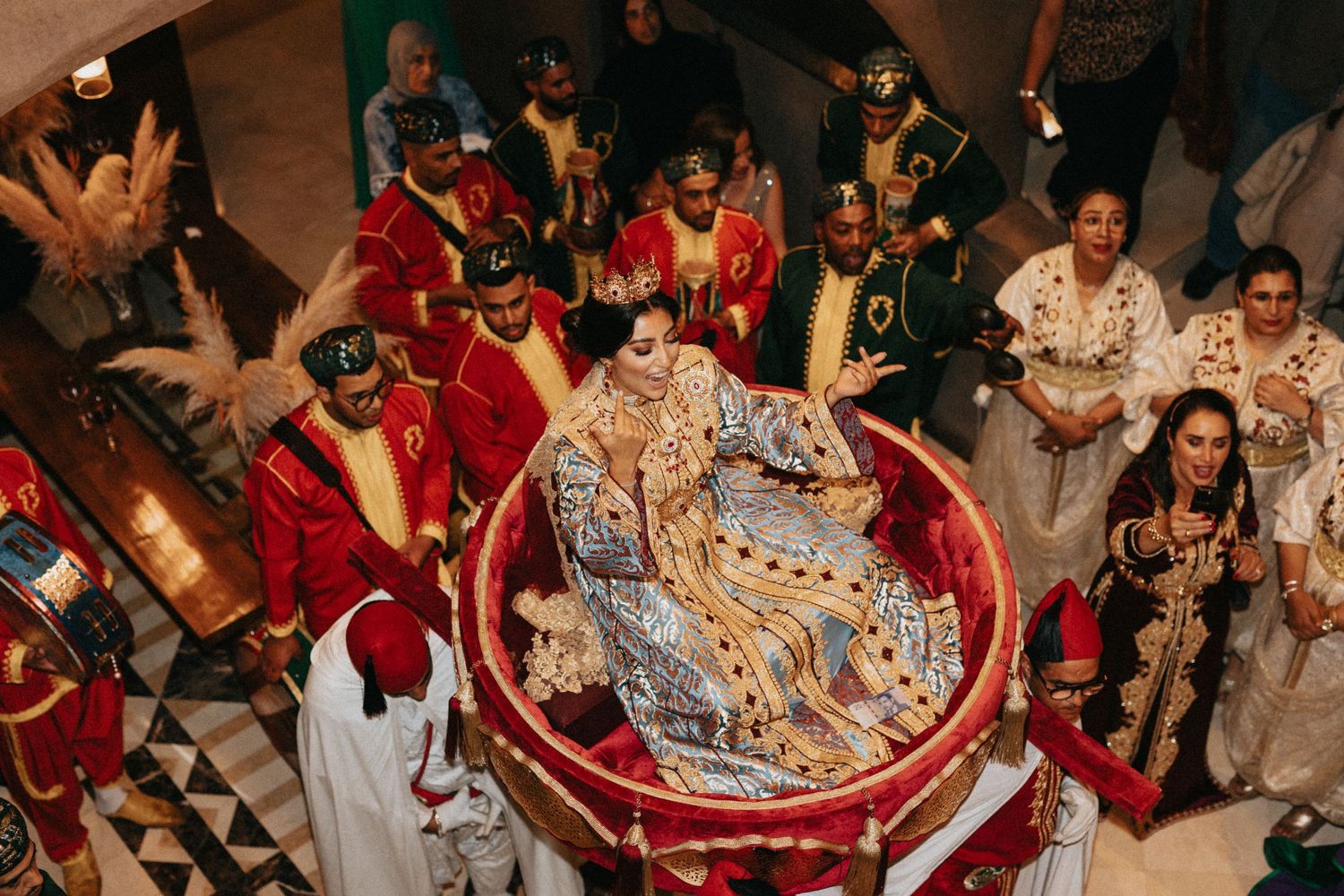 Grand Amaria entrance with bride in caftan at a Marrakech wedding celebration