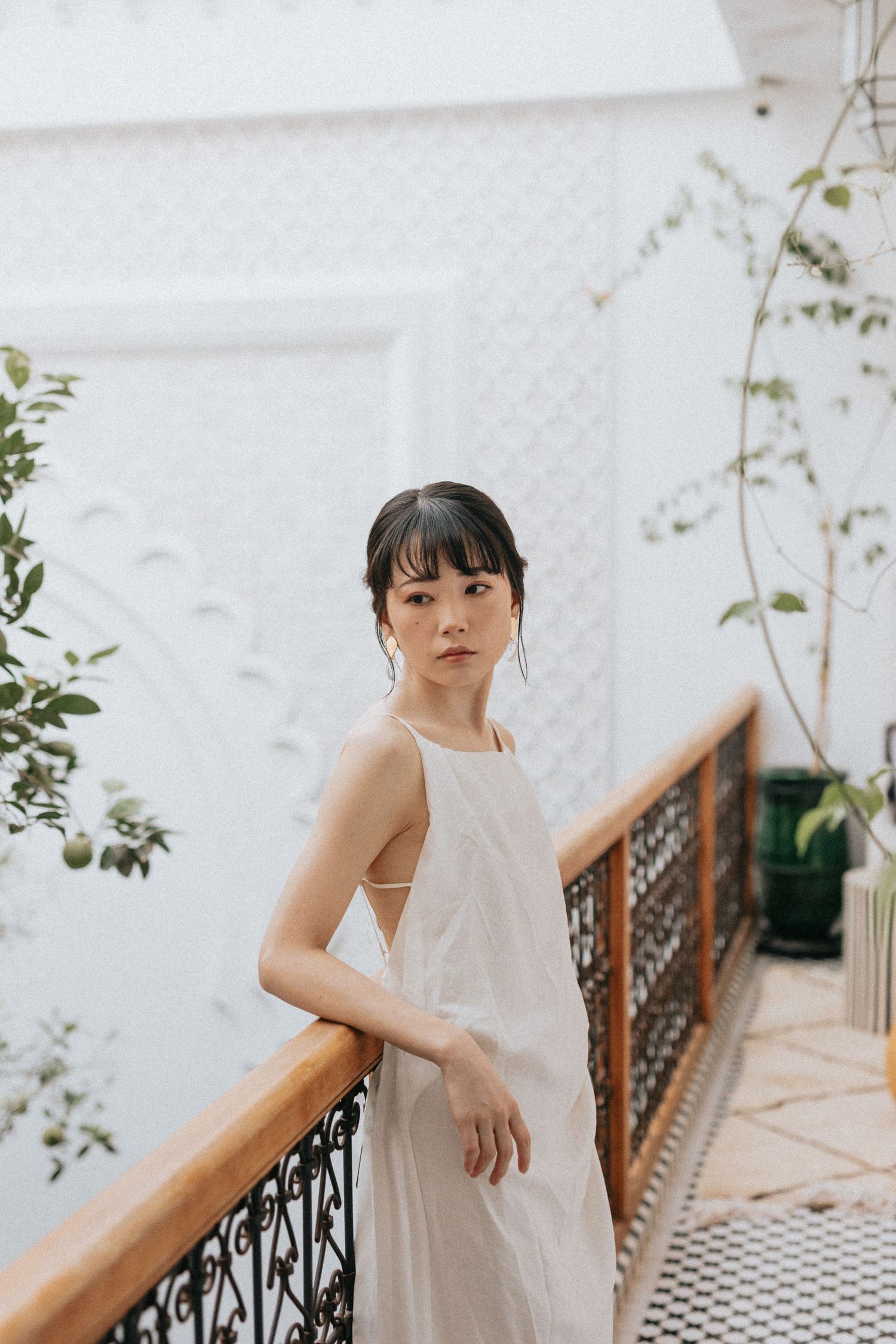 Elegant bridal portrait surrounded by zellige tiles and soft natural light