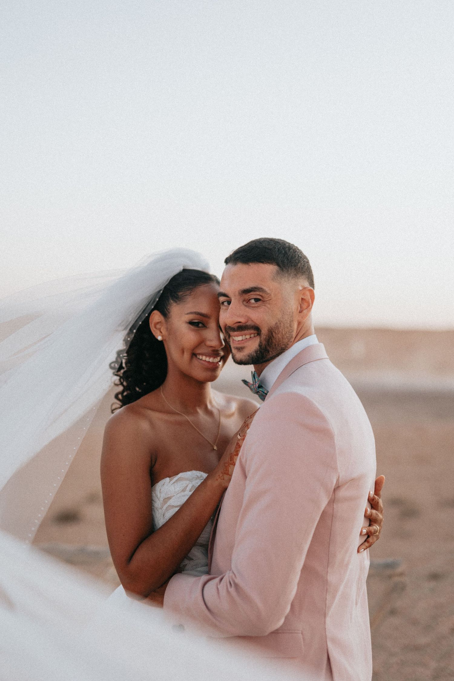 bride and groom portrait in the desert of agafay morocco marrakech